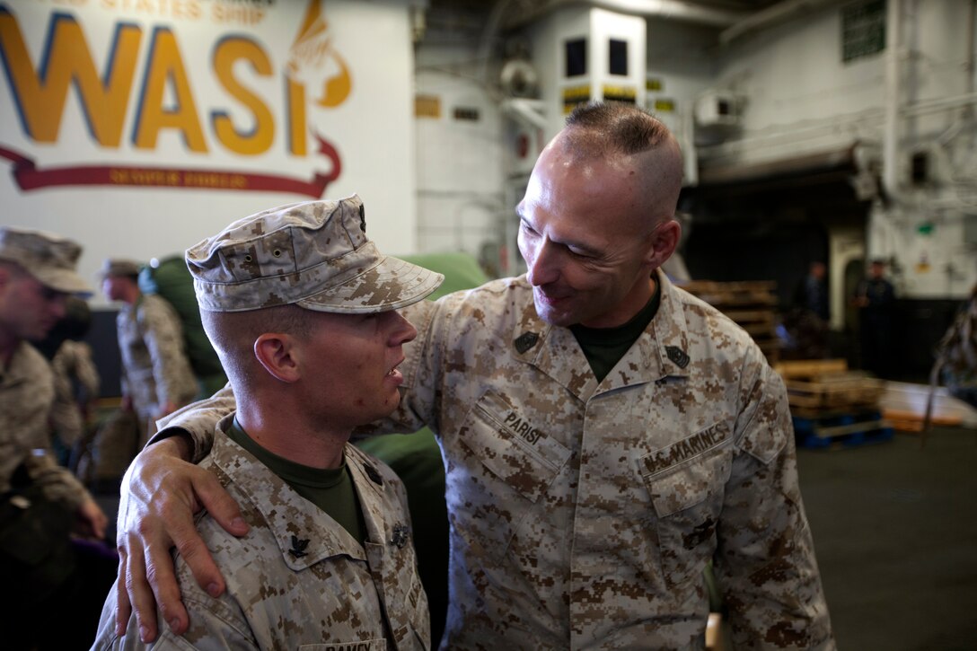 Sgt. Maj. Todd M. Parisi, 26th Marine Expeditionary Unit sergeant major, right, talks to Hospitalman 3rd Class Daniel Ramey, 26th MEU corpsman, boarding the USS Wasp at Norfolk Naval Station, Va., April 9, 2012.The 26th Marine Expeditionary Unit is currently providing support to the Commemoration of the Battle of New Orleans. Starting this April and continuing through 2015, the U.S. Navy, U.S. Marine Corps and U.S. Coast Guard will commemorate the Bicentennial of the War of 1812 and the Star Spangled Banner.  The War of 1812 celebration will commemorate the rich Naval history and showcase the capabilities of today's Navy-Marine Corps team.