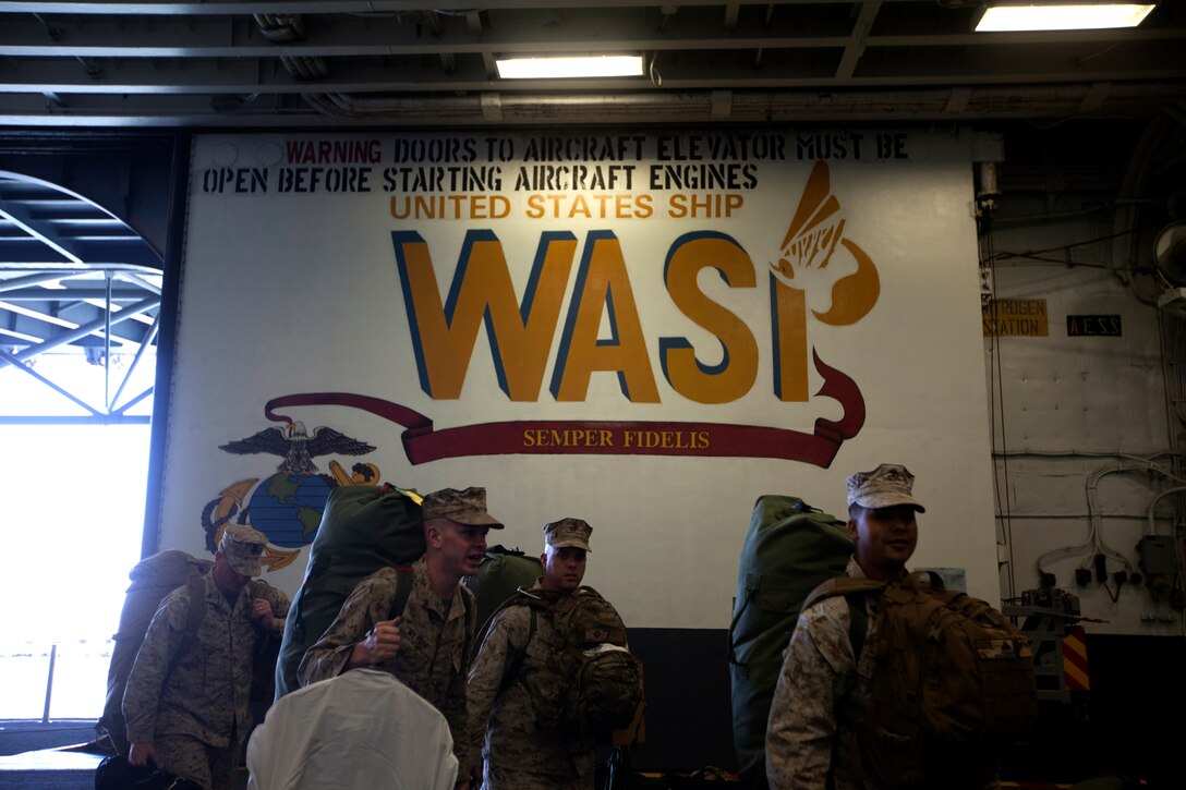 Marines of the 26th Marine Expeditionary Unit board the USS Wasp at Norfolk Naval Station, Va., April 9, 2012.The 26th Marine Expeditionary Unit is currently providing support to the Commemoration of the Battle of New Orleans. Starting this April and continuing through 2015, the U.S. Navy, U.S. Marine Corps and U.S. Coast Guard will commemorate the Bicentennial of the War of 1812 and the Star Spangled Banner.  The War of 1812 celebration will commemorate the rich Naval history and showcase the capabilities of today's Navy-Marine Corps team.