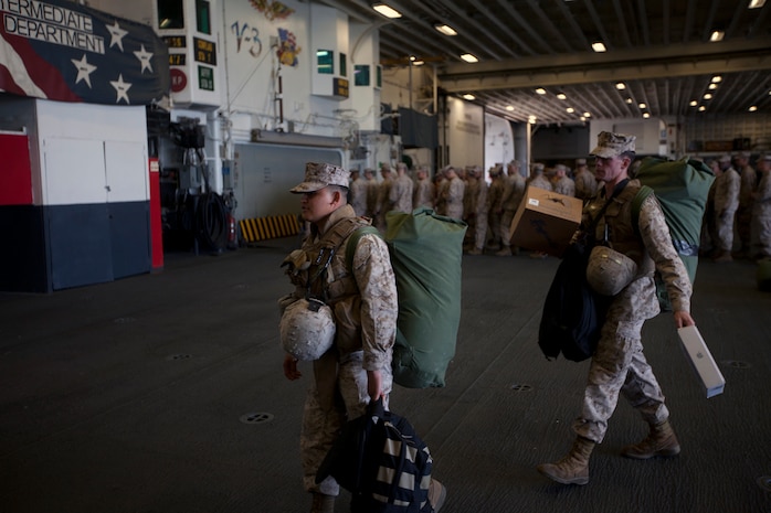 Marines of the 26th Marine Expeditionary Unit on load their gear as they board the USS Wasp at Norfolk Naval Station, Va., April 9, 2012. The 26th Marine Expeditionary Unit is currently providing support to the Commemoration of the Battle of New Orleans. Starting this April and continuing through 2015, the U.S. Navy, U.S. Marine Corps and U.S. Coast Guard will commemorate the Bicentennial of the War of 1812 and the Star Spangled Banner.  The War of 1812 celebration will commemorate the rich Naval history and showcase the capabilities of today's Navy-Marine Corps team.