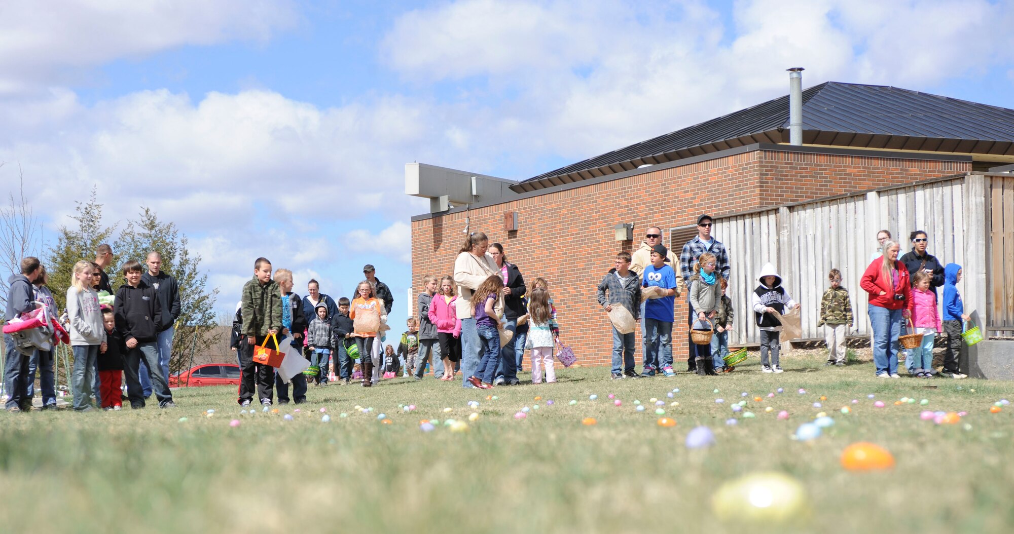Children and their families eagerly wait for the start of the Easter egg hunt at the Exchange at Ellsworth Air Force Base, S.D., April 7, 2012. Children of different age groups hunted for hundreds of plastic eggs filled with numerous prizes that ranged from candy to new bicycles andmovie passes .  (U.S. Air Force photo by Airman 1st Class Anania Tekurio/Released)