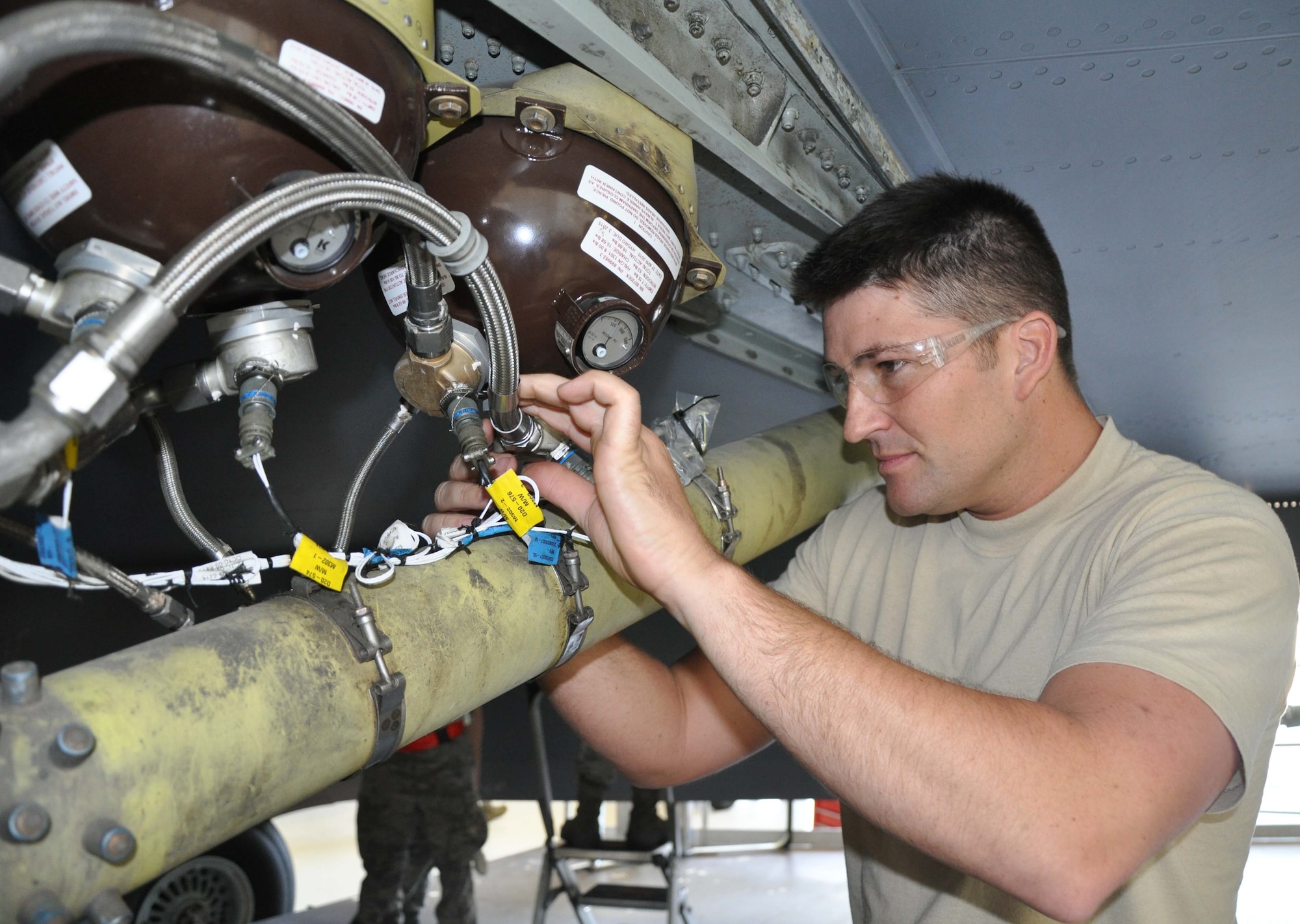 Tech. Sgt. Nick Klenke, electrical and environmental craftsman, 931st Maintenance Squadron inspects the wiring on the engine fire suppression system of a KC-135 Stratotanker during a phase inspection. (Air Force photo by Staff Sgt. Carrie Peasinger)