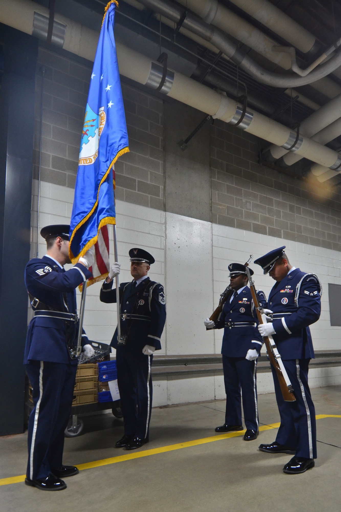 Members of the 128th Air Refueling Wing’s Honor Guard, Staff Sgt. Velazquez (left) Master Sgt. Coker, Airman First Class Petty and Airman First Class Hildebrand (right) prepare the colors for presentation just before the Milwaukee Brewers’ Opening Day game vs. the World Series Champion St. Louis Cardinals at Miller Park in Milwaukee Friday, April 6, 2012. The 128th's Honor Guard is a regular participant in many community events in the Milwaukee area. (U.S. Air Force Photo by: Senior Master Sgt. Jeffrey A. Rohloff) (Released)