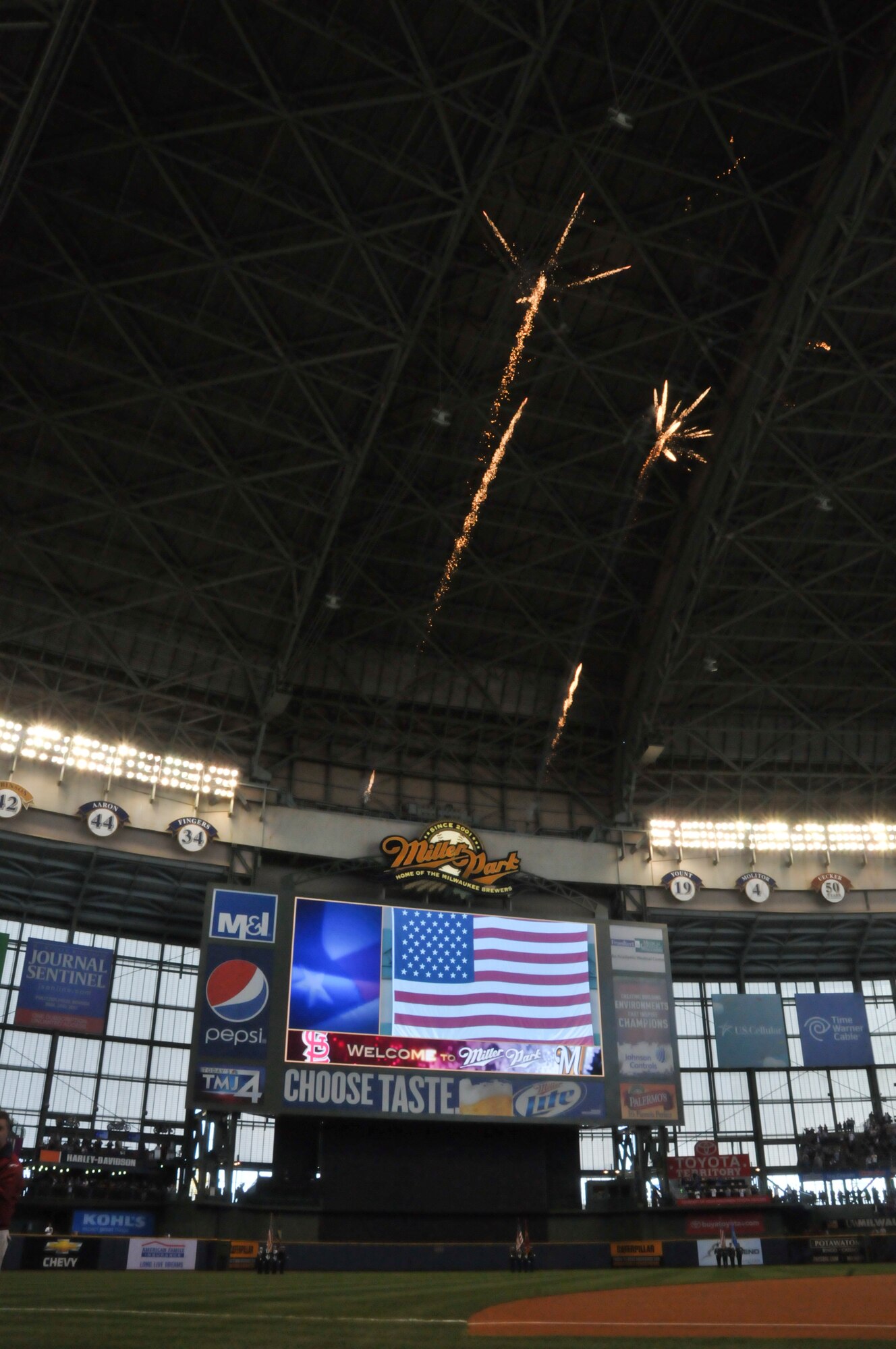 A fireworks display is launched at the conclusion of the National Anthem just before the first pitch of the Milwaukee Brewers’ Opening Day game vs. the World Series Champion St. Louis Cardinals at Miller Park in Milwaukee Friday, April 6, 2012.  The 128th’s Honor Guard and Honor Guards from other branches of service presented the colors during the National Anthem.  (U.S. Air Force Photo by: 2nd Lt. Nathan T. Wallin) (Released)