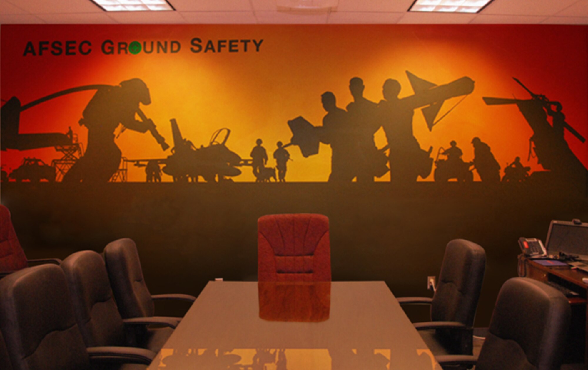 The mural in the conference room of the Ground Safety Division, Air Force Safety Center, was recently created as a visual reminder that ground safety impacts everyone, on and off duty. The 153-square-foot mural was painted by Dan Harman, graphic artist and designer, who will retire April 30 with 23 years of federal service. (U.S. Air Force photo by Dan Harman)