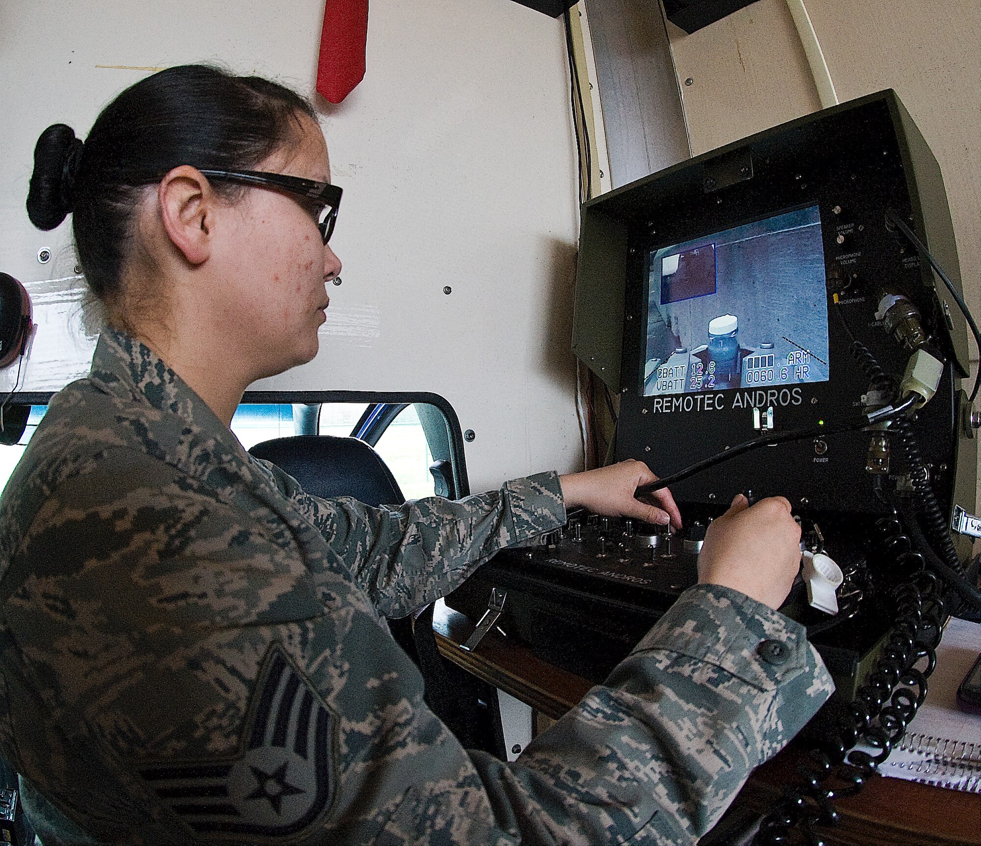 Staff Sgt. Sue Bostic, an explosive ordnance disposal technician with the 436th Civil Engineer Squadron, operates an F6 robot during a training exercise March 20, 2012, at the EOD range on Dover Air Force Base, Del. Bostic operated the robot from a truck at a safe distance. (U.S. Air Force photo by Senior Airman Jacob Morgan)