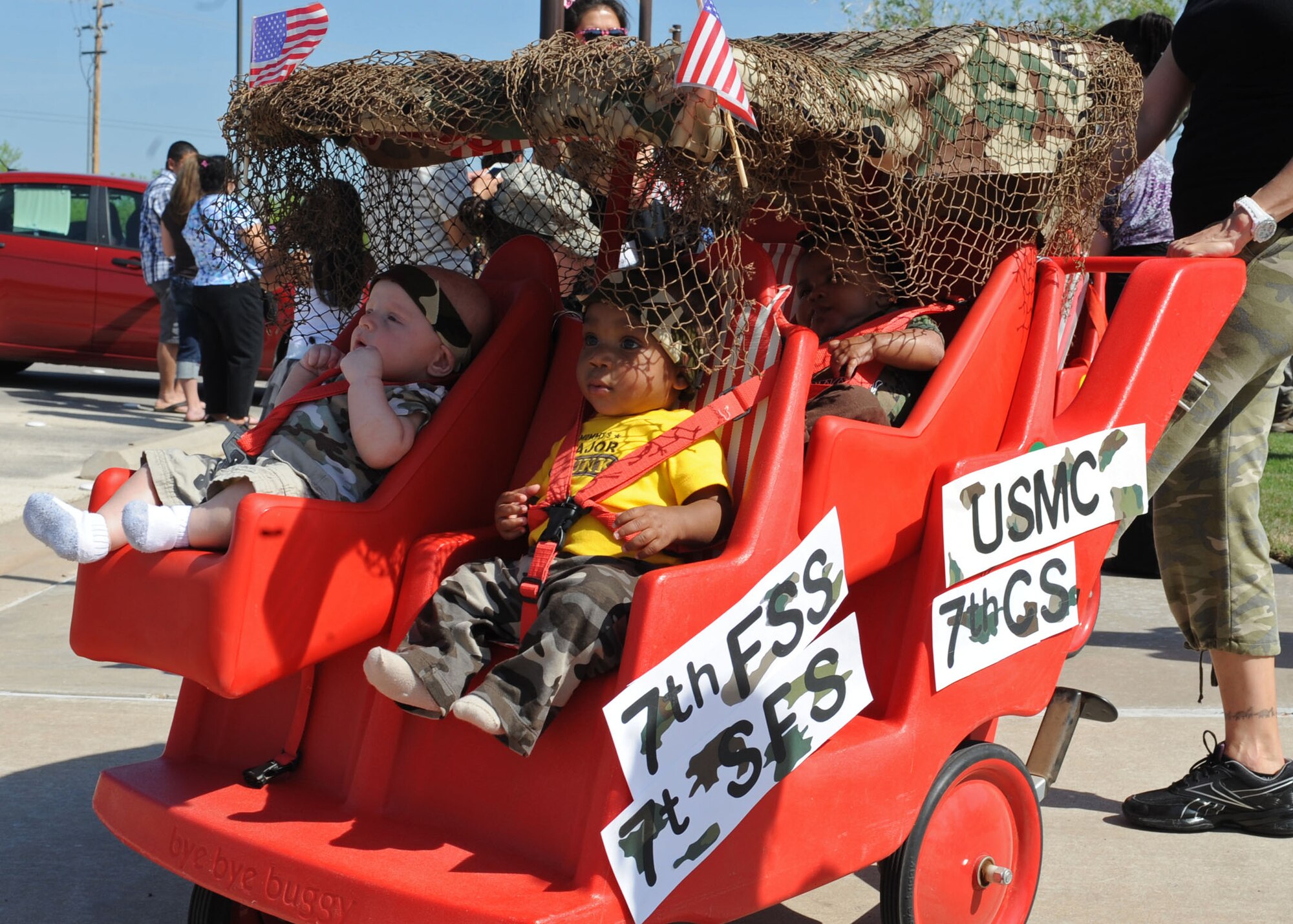 Children from the Child Development Center take part in the annual CDC parade April 6, 2012, at Dyess Air Force Base, Texas. The CDC is a modernized facility which provides a diverse and rewarding developmental experience for children ages six weeks old to six years old. (U.S. Air Force photo by Airman 1st Class Peter Thompson/Released)