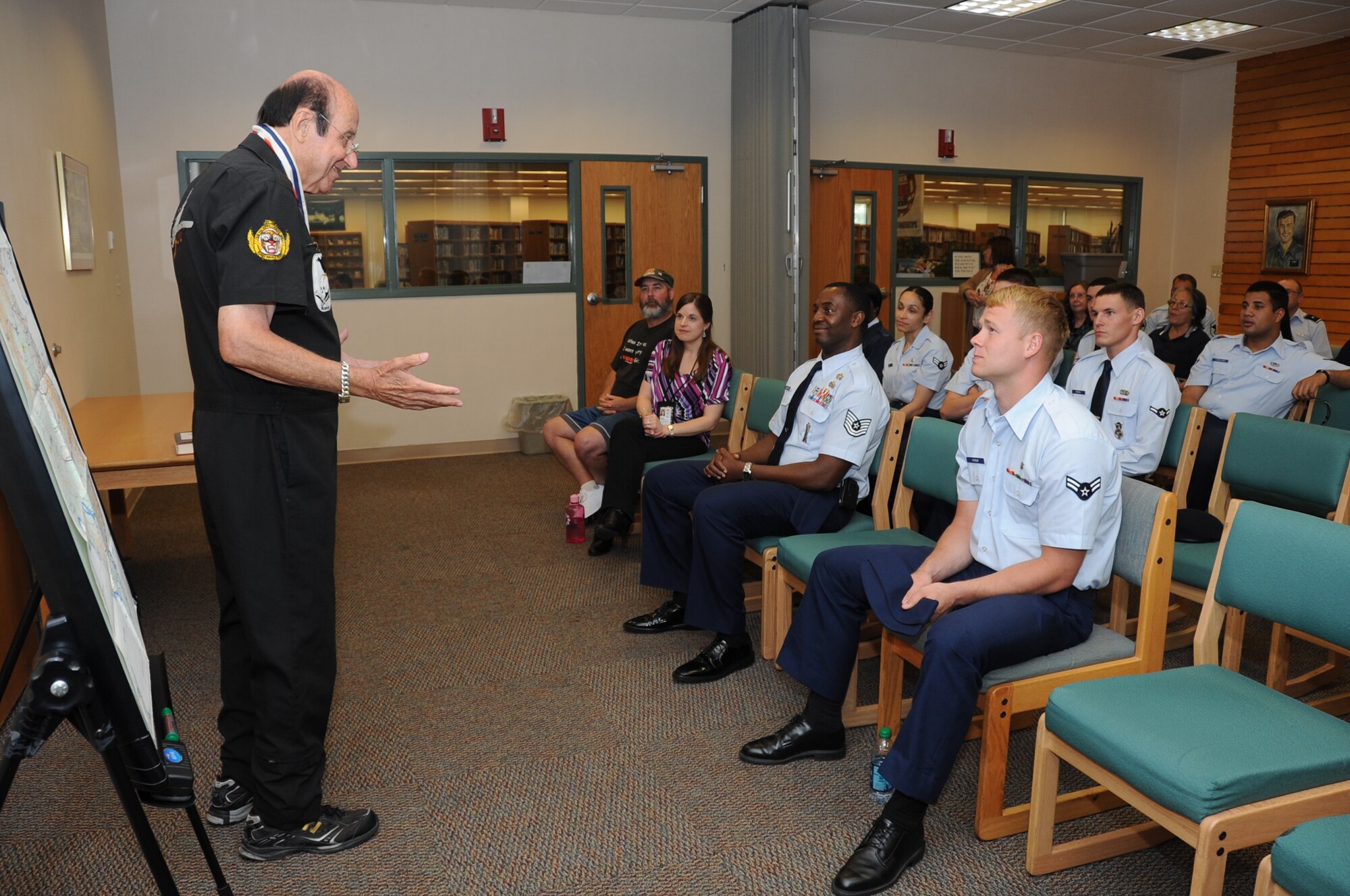Retired Col. Mike Cavanaugh addresses the audience during a visit to the McBride Library, April 9, 2012, at Keesler Air Force Base, Miss.  Cavanaugh, who currently lives in Thailand, pays a visit to the base to share memories from his time during the Vietnam War as a Raven and also of Maj. Edward “Hoss” McBride, whom the library is named after.  Ravens were the classified and prestigious pilots who accomplished missions all over Southeast Asia in the Vietnam era.  (U.S. Air Force photo by Kemberly Groue)