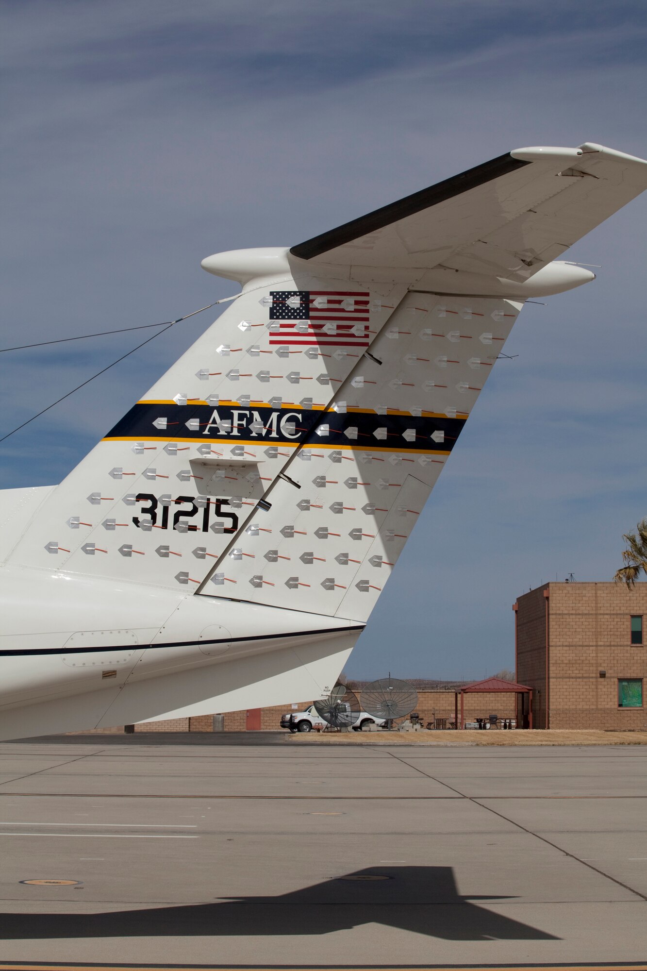 The tufting visible on the tail of the C-12 Huron played a critical role in the SPINAL TAP test management project. It allowed the team to investigate the force-lightening anomaly using flow visibility. Testing was done during a series of maneuvers performed over the course of six sorties. (Air Force Photo by Chris Neil)