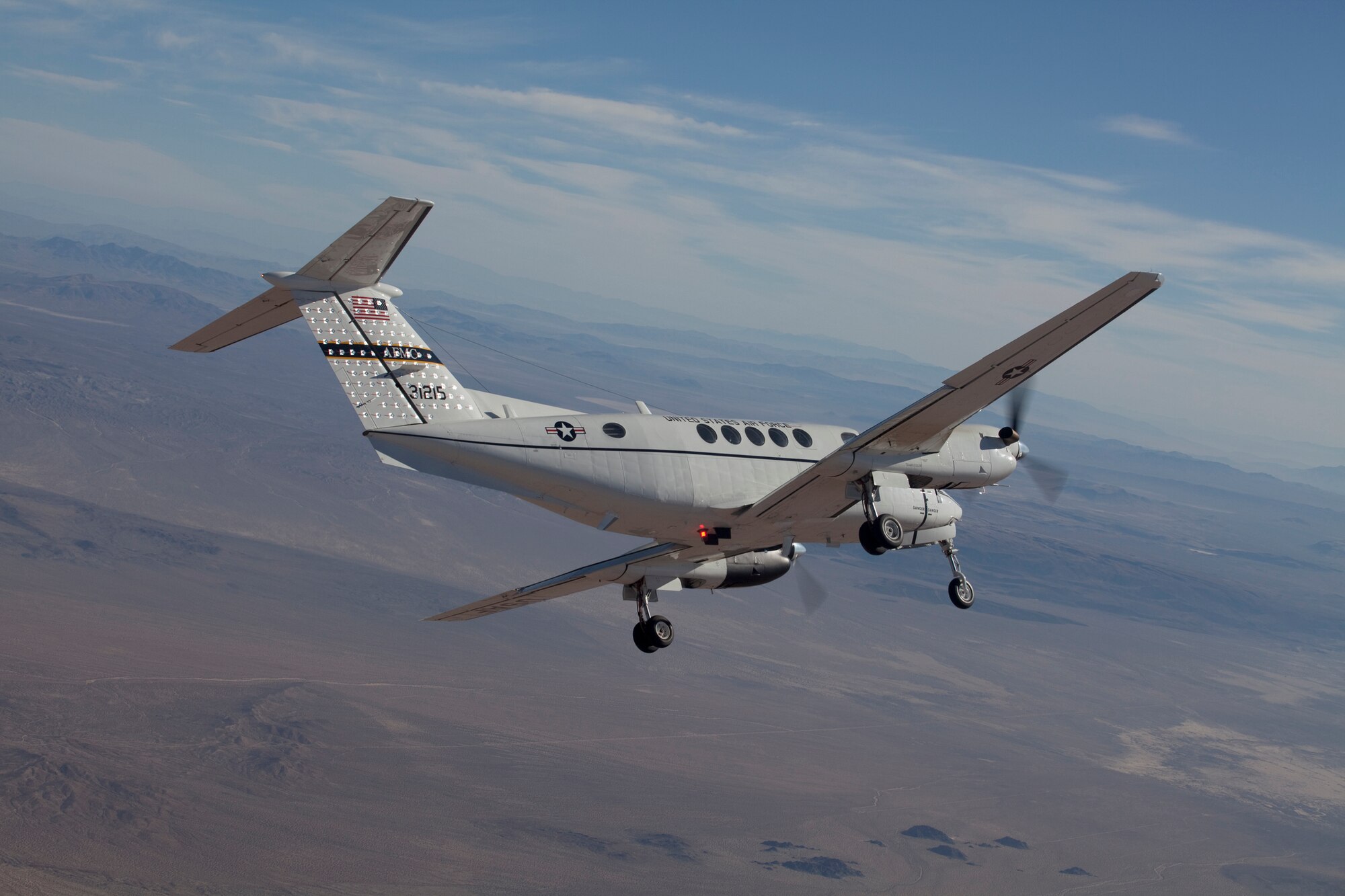 The test management project SPINAL TAP, short for Science Project in Aircraft Laboratory, Tufted Aircraft Panels, began last December hoping to investigate the phenomenon with flow visibility on a tufted vertical tail. Two sorties were videotaped from a C-12 chase aircraft, allowing the team to review data and visually identify how the tail of the aircraft responded during the various airspeeds and aircraft configurations. (Air Force Photo by Chris Neil)