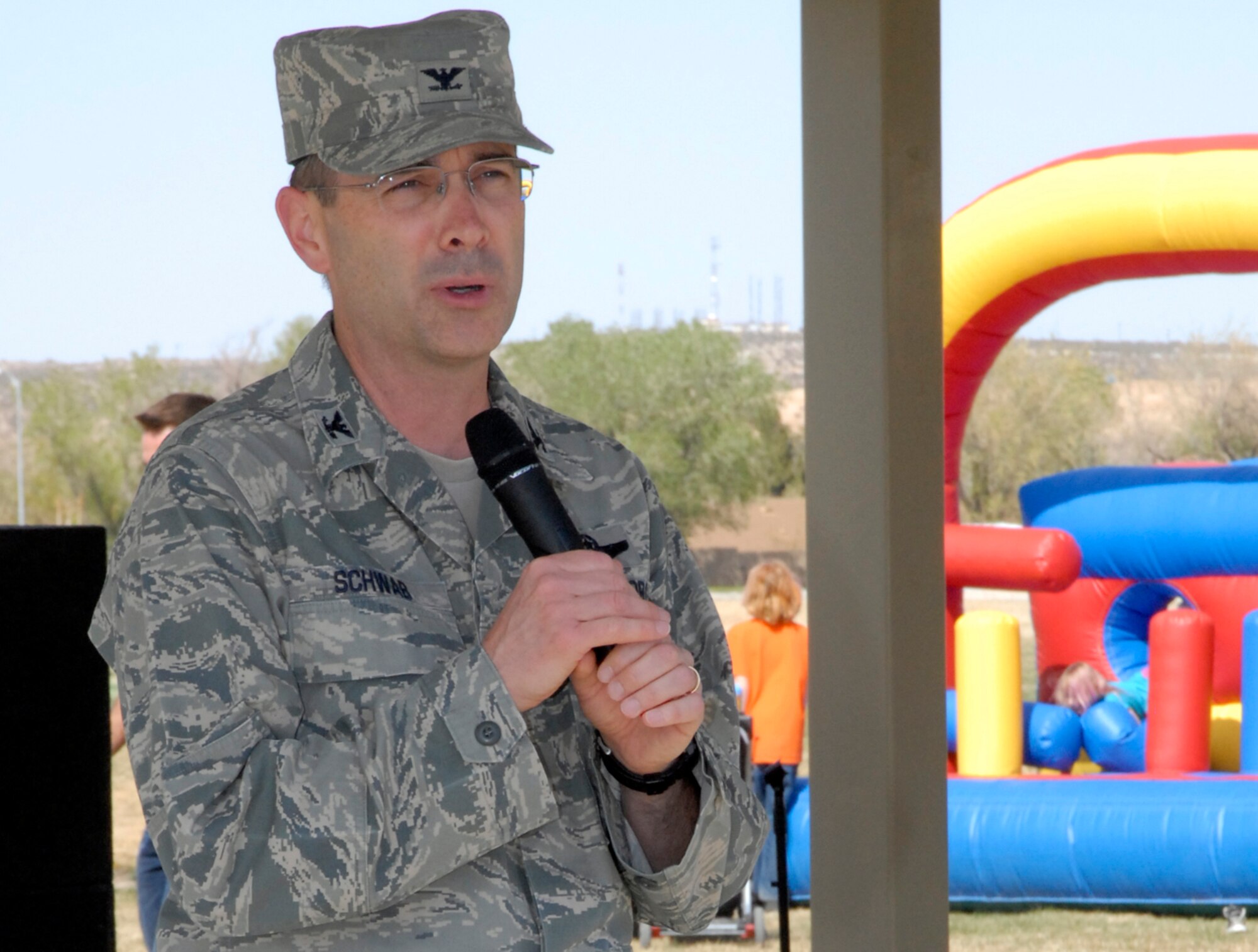 After signing the proclamation, officially declaring April as Child Abuse Prevention Month, Col. Gregory E. Schwab, 95th Air Base Wing commander, thanked attendees at the Play Day in the Park event April 6 for their dedication to raising awareness about child abuse prevention. (Air Force Photo by Laura Mowry)