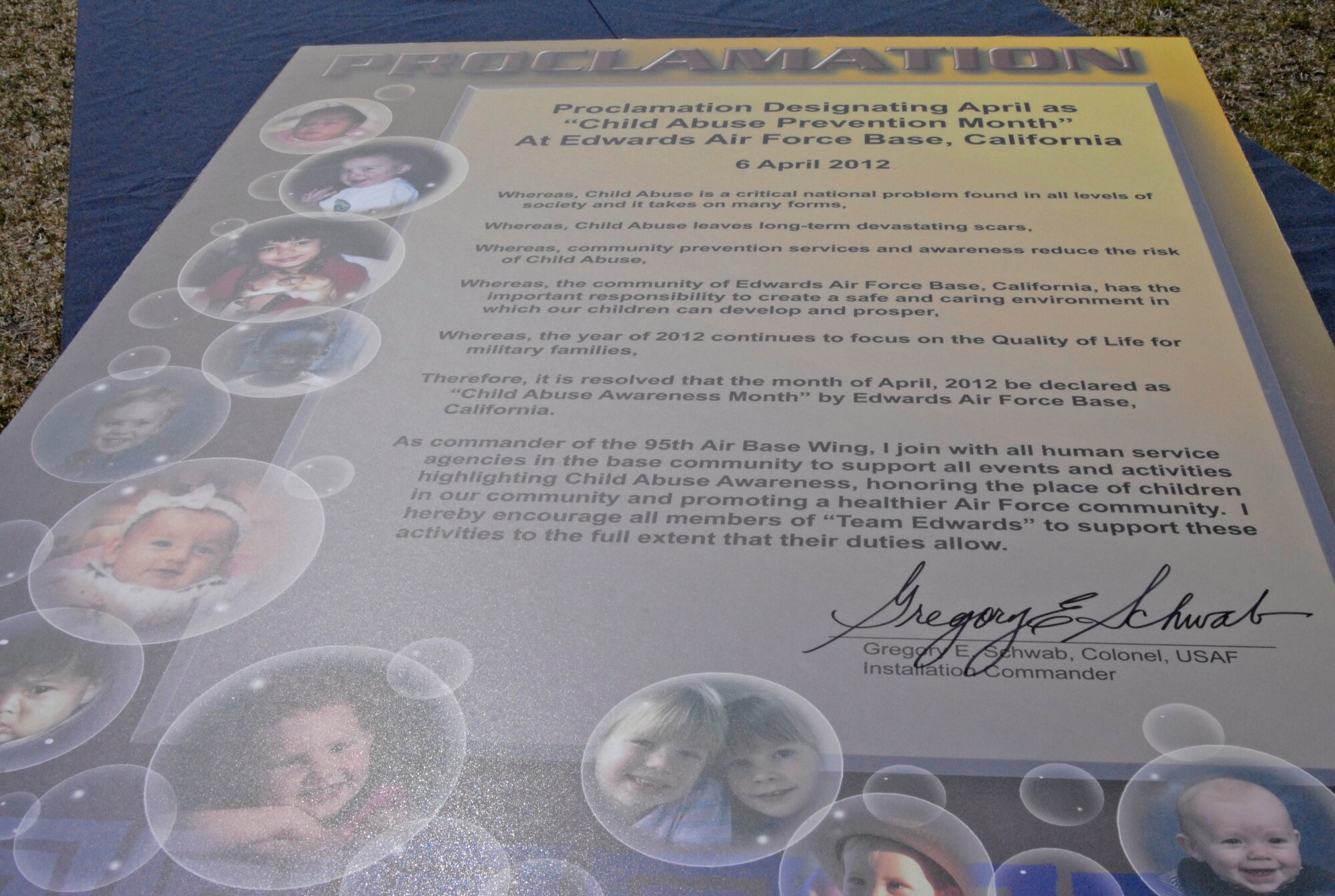During the Play Day in the Park event, Col. Gregory E. Schwab, 95th Air Base Wing commander signed a proclamation April 6, officially declaring April as Child Abuse Prevention Month at Edwards. The signing of the proclamation signified Team Edwards' commitment to raising awareness and preventing child abuse. (Air Force Photo by Laura Mowry)