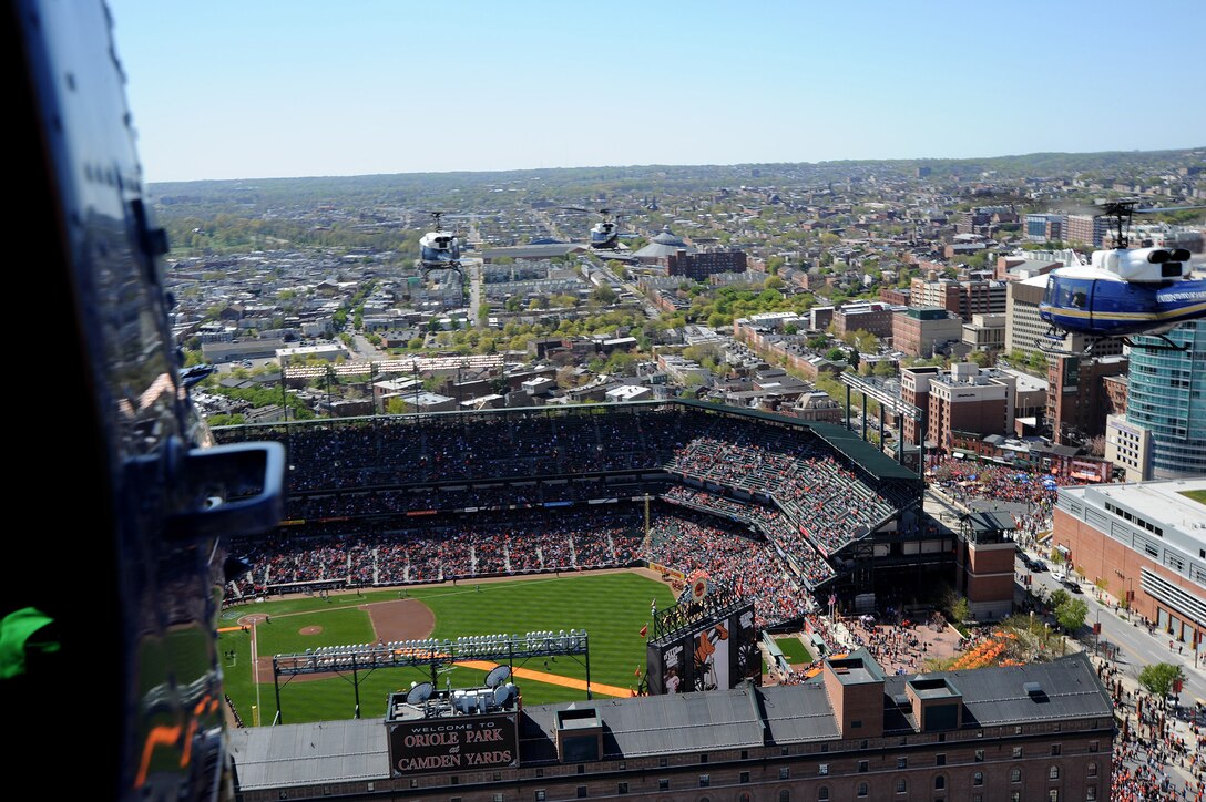 BALTIMORE, Md. -- Four UH-1N Iroquois from the 1st Helicopter Squadron at Joint Base Andrews, Md., fly over Oriole Park at Camden Yards in Baltimore, Maryland for the Baltimore Orioles season opener April 6. The 1st Helicopter Squadron's primary mission is to support key government officials as well as search and rescue missions.(U.S. Air Force photo/ Staff Sergeant Matt Coleman-Foster)