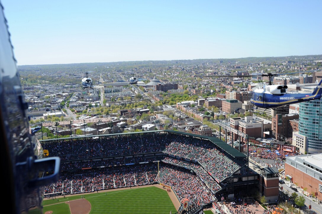 BALTIMORE, Md. -- Four UH-1N Iroquois from the 1st Helicopter Squadron at Joint Base Andrews, Md., fly over Oriole Park at Camden Yards in Baltimore, Maryland for the Baltimore Orioles season opener April 6. The 1st Helicopter Squadron's primary mission is to support key government officials as well as search and rescue missions.(U.S. Air Force photo/ Staff Sergeant Matt Coleman-Foster)