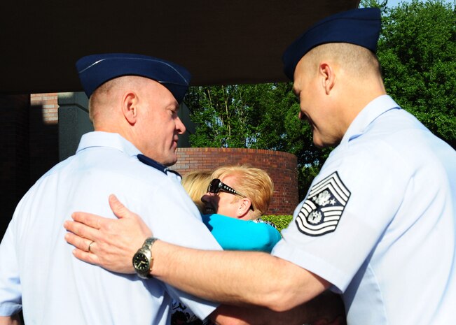 Col. Richard McComb greets Chief Master Sergeant of the Air Force James Roy upon his arrival at Joint Base Charleston - Air Base April 9. McComb is the JB Charleston commander. (U.S. Air Force photo/Staff Sgt. Katie Gieratz) 