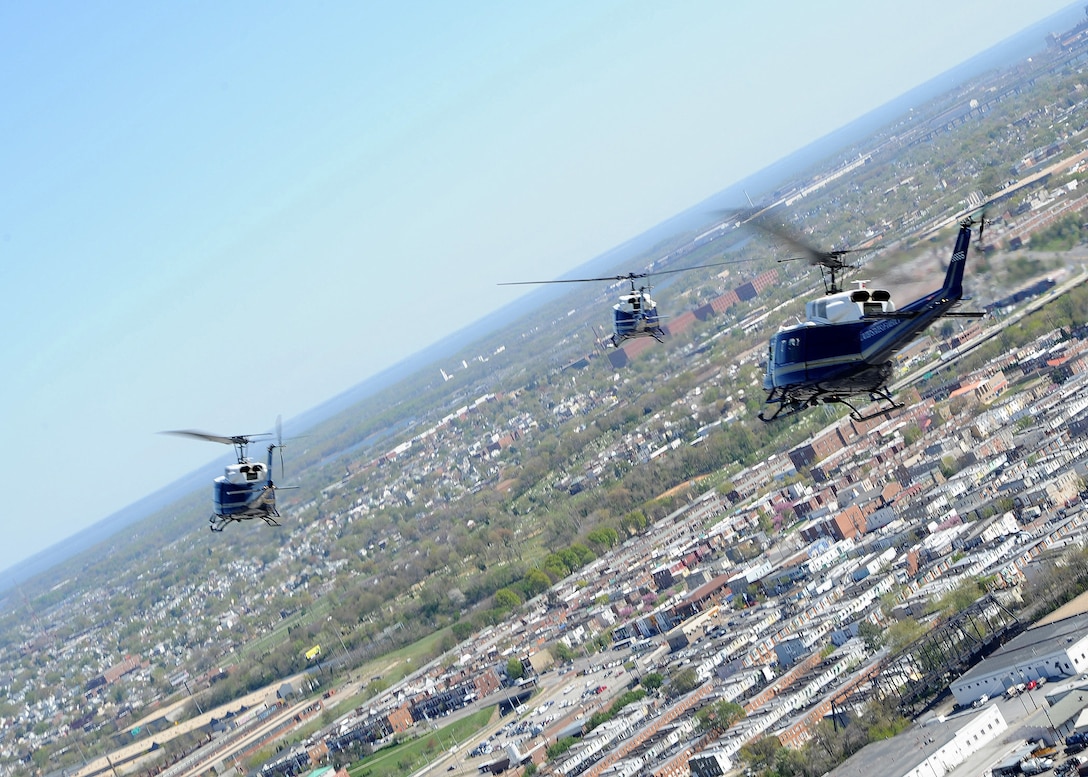 BALTIMORE, Md. -- A group of  UH-1N Iroquois from the 1st Helicopter Squadron at Joint Base Andrews, Md., bank in the direction of Camden Yards as they prepare to fly over the Baltimore Orioles 2012 season opening ceremonies April 6.  The 1st Helicopter Squadron's primary mission is to support key government officials as well as search and rescue missions.(U.S. Air Force photo/ Staff Sergeant Matt Coleman-Foster)