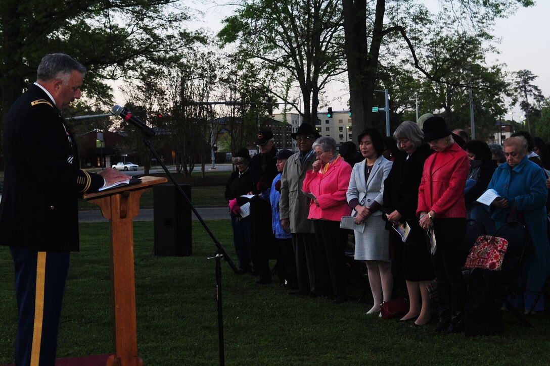 U.S. Army Chap. (Maj.) Raymond Folsom, pastoral coordinator, delivers the invocation during the Easter Sunrise service at the Fort Eustis' Regimental Memorial Chapel April 8, 2012. (U.S. Air Force photo by Staff Sgt. Ashley Hawkins/Released)