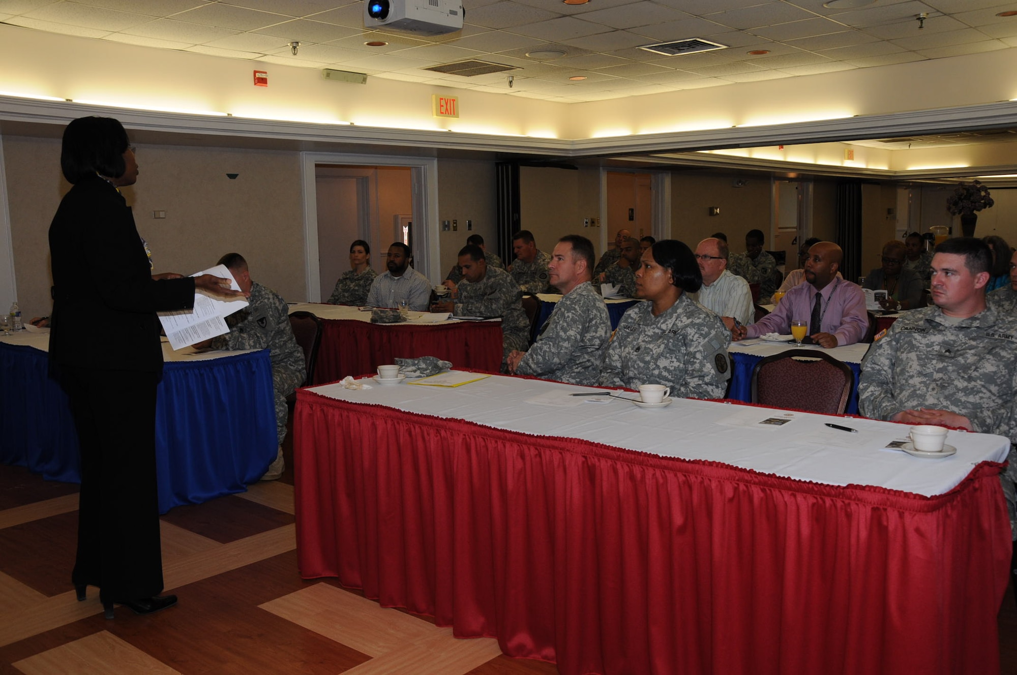 Debra Stancil, assistant AER officer, answers question during the Army Emergency Relief assistance campaign held at the Fort Eustis Club at Fort Eustis, Va., March 21, 2012. Eustis received a distribution just under a million dollars that supported close to 800 Soldiers and families. (U.S. Air Force photo by Tetaun Moffett/Released)