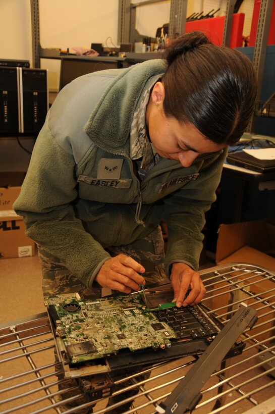A1C Sheryl Easley works on a circuit board in the communications maintenance shop.