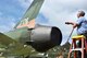 Alan Johns, 42nd Operations Support Flight contractor, washes pollen from a F-105D Thunderchief static display at Maxwell Air Force Base, Ala., April 4. Contractors from the 42nd OSF wash the 12 static displays on Maxwell and Gunter Annex twice a year to enhance the appearnce and prevent corrosion from forming on some of the nearly 20 year old displays. (U.S. Air Force photo by Master Sgt. Michael Voss)