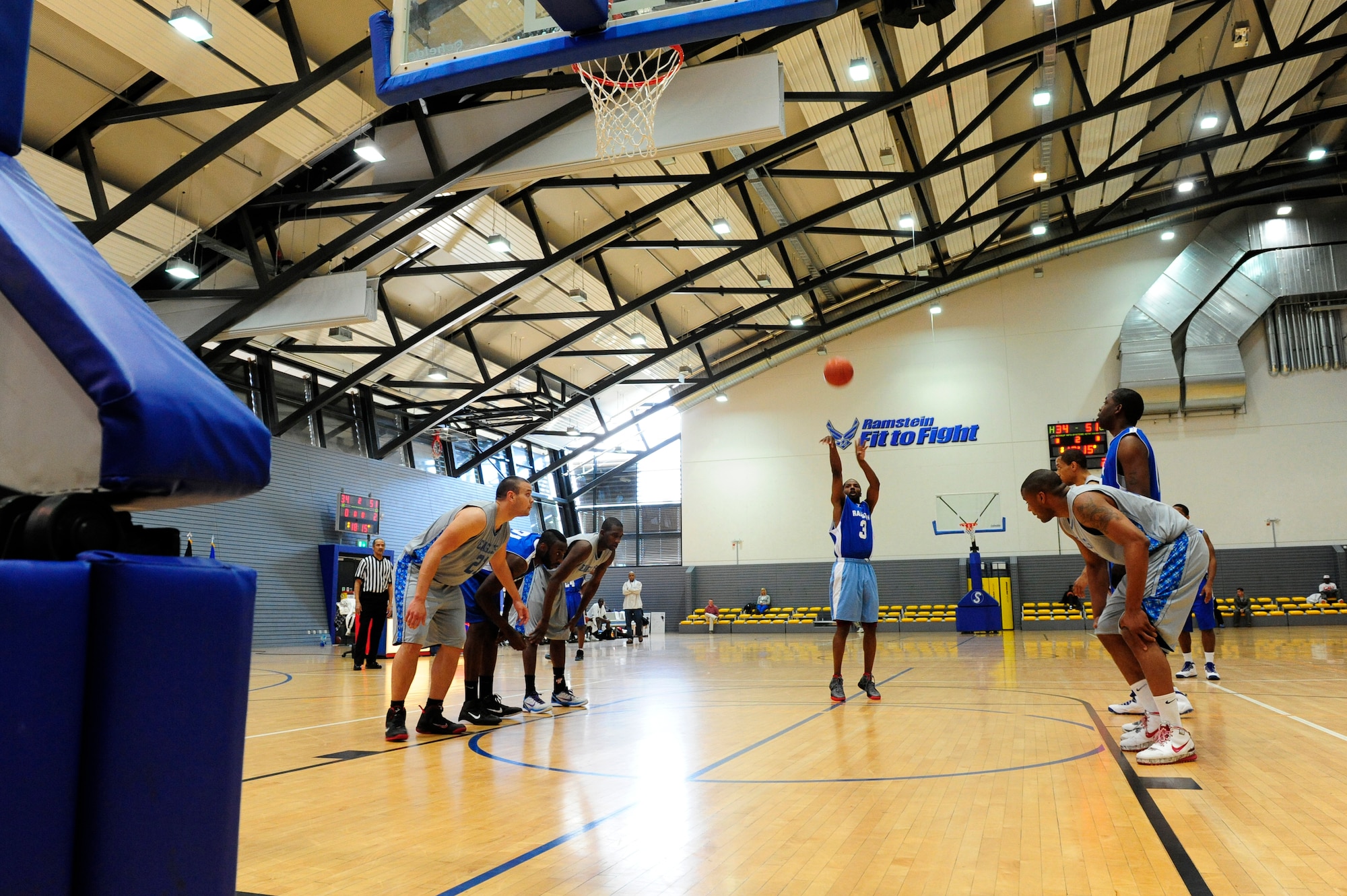 A member of the Ramstein Rams shoots a free throw after being fouled by a member of the Lakenheath Eagels, during the championship game of the U.S. Forces in Europe basketball tournament, Ramstein Air Base, Germany, April 8, 2012. The Ramstein Rams defeated the Lakenheath Eagles 84 to 78 for the championship. Ramstein Rams won 7 total games, making them the only Ramstein team to win that many games in a tournament and sweep through all Army and Air Force tournaments offered throughout the year. (U.S. Air Force photo/ Senior Airman Aaron-Forrest Wainwright)