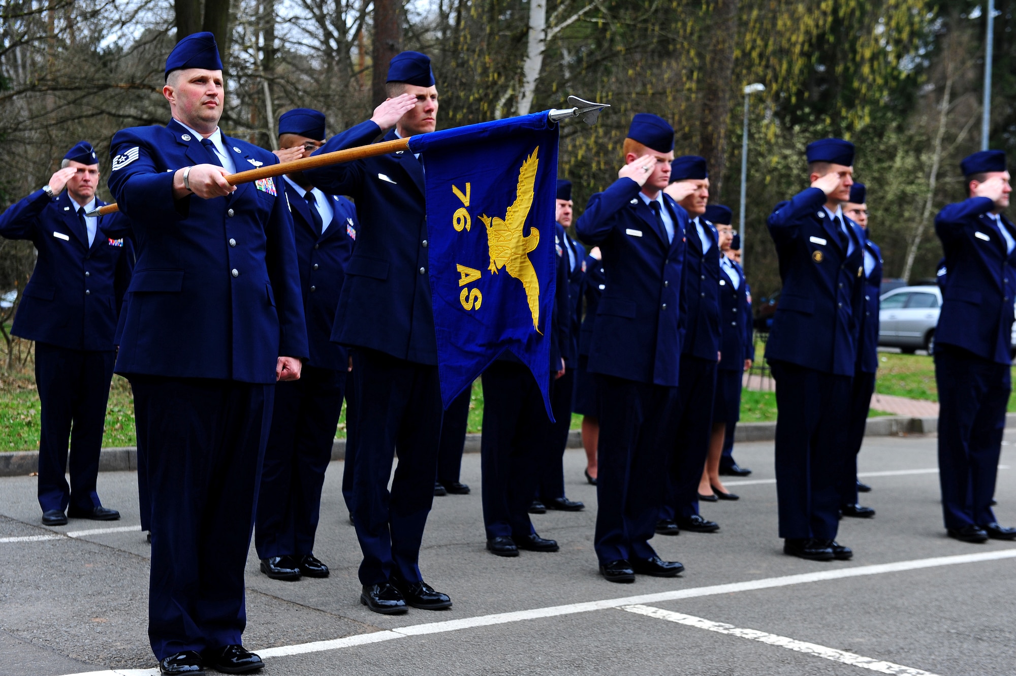 Air Force members from the 76th Airlift Squadron salute during a memorial ceremony on Ramstein Air Base, Germany, April 5, 2012. The squadron honored the six crew members of flight IFO-21. On April 3, 1996, a CT-43 aircraft that was assigned to the 76th AS crashed outside of Dubrovnik Croatia during a peacekeeping mission. This year marked the 16th anniversary. (U.S. Air Force photo by Amn Brea Miller)