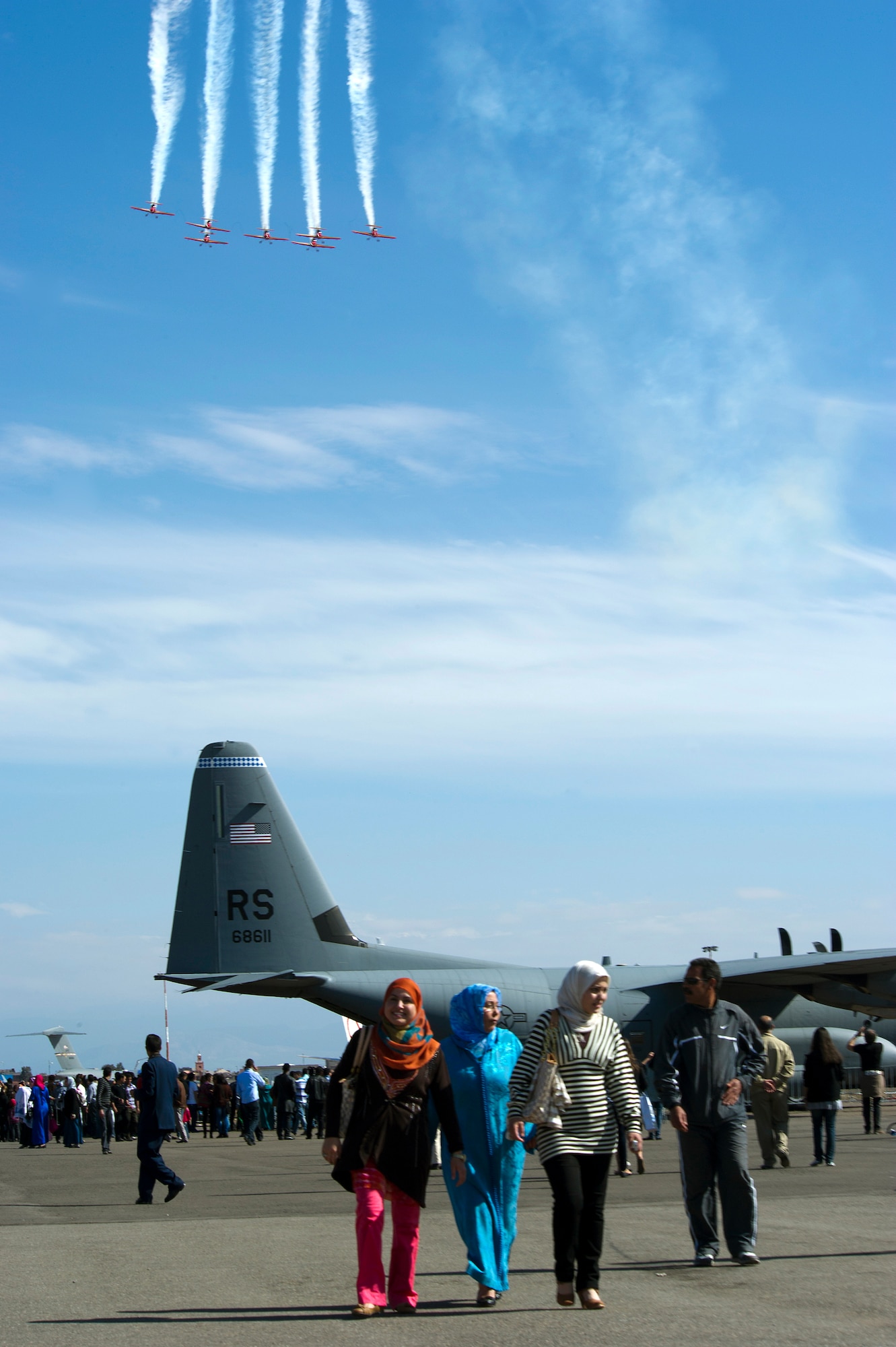 MARRAKECH, Morocco -- A crowd of people fill the flightline at Aeroexpo Marrakech 2012 as the Royal Moroccan Air Force aerial demonstration team "The Green March" perform April 7, 2012. U.S. Air Forces Africa participated in the third biennial Aeroexpo Marrakech to strengthen the partnerships with the nations involved and show commitment to security and stability in the region. (U.S. Air Force photo/Staff Sgt. Benjamin Wilson)