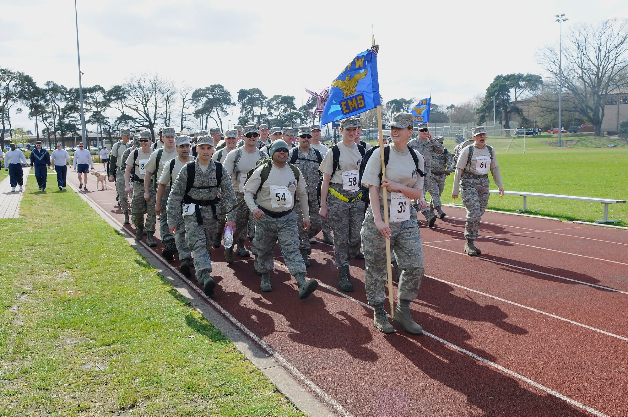 ROYAL AIR FORCE LAKENHEATH, England - Members of the 48th Equipment Maintenance Squadron and 48th Medical Group ruck march in the second annual Phil Myers Memorial Run at the RAF Lakenheath running track April 5, 2012. Myers was a member of the 48th Civil Engineer Squadron explosive ordnance disposal flight who died as a result of an improvised explosive device attack while deployed to Afghanistan in 2009.  The 5K run/walk began at the track and ended at the Phil Myers Memorial on Myers Way.  All donations from the event will go to the EOD Memorial Foundation and the Wounded Warrior Project.  (U.S. Air Force photo by Staff Sgt. Connor Estes)