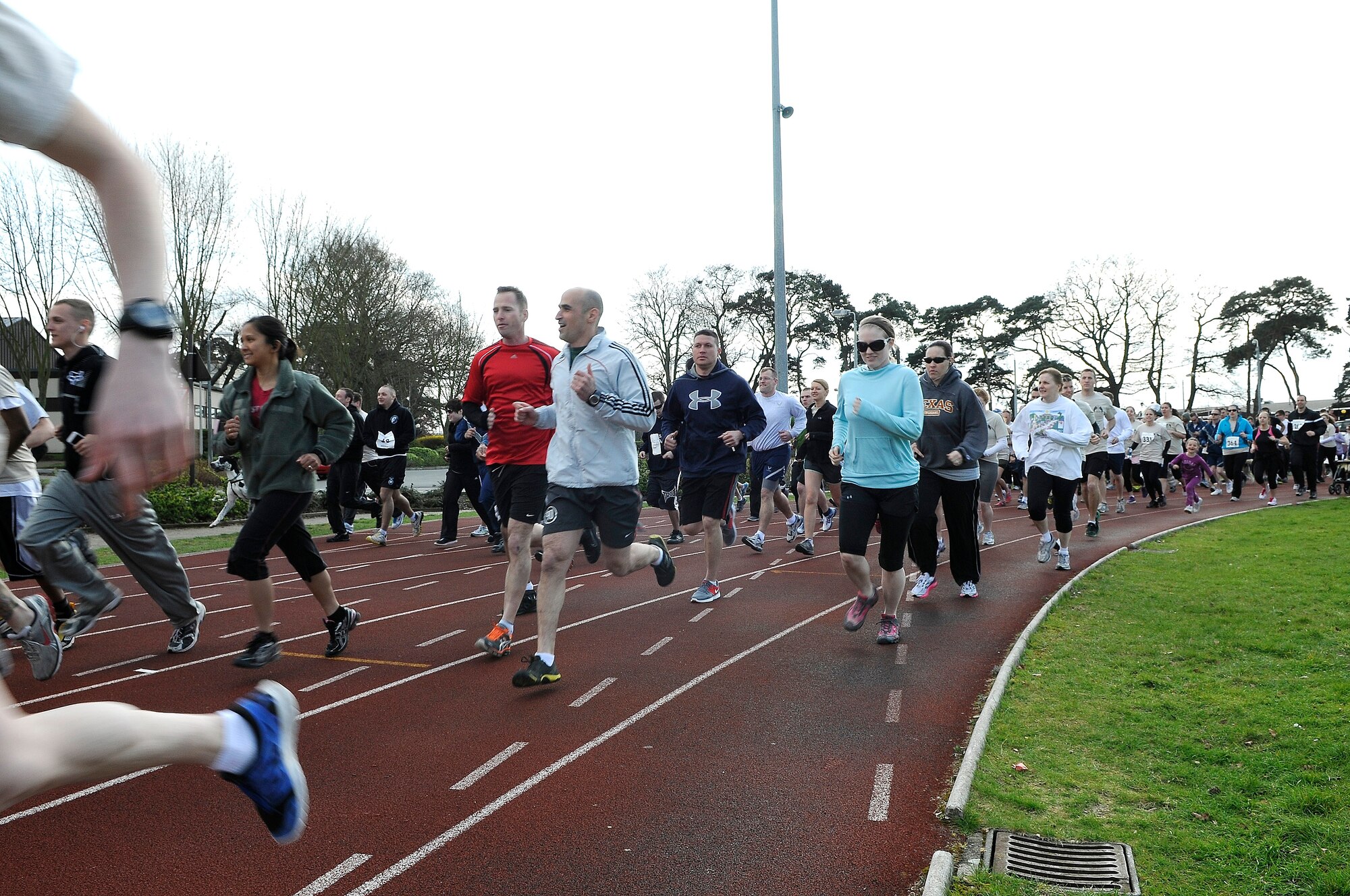 ROYAL AIR FORCE LAKENHEATH, England -- Members of the 48th Fighter Wing and their families came out to run or ruck at the second annual Phil Myers Memorial Run at the RAF Lakenheath running track April 5, 2012. Myers was a member of the 48th Civil Engineer Squadron explosive ordnance disposal flight who died as a result of an improvised explosive device attack while deployed to Afghanistan in 2009.  The 5K run/walk began at the track and ended at the Phil Myers Memorial on Myers Way.  All donations from the event will go to the EOD Memorial Foundation and the Wounded Warrior Project.  (U.S. Air Force photo by Staff Sgt. Connor Estes)