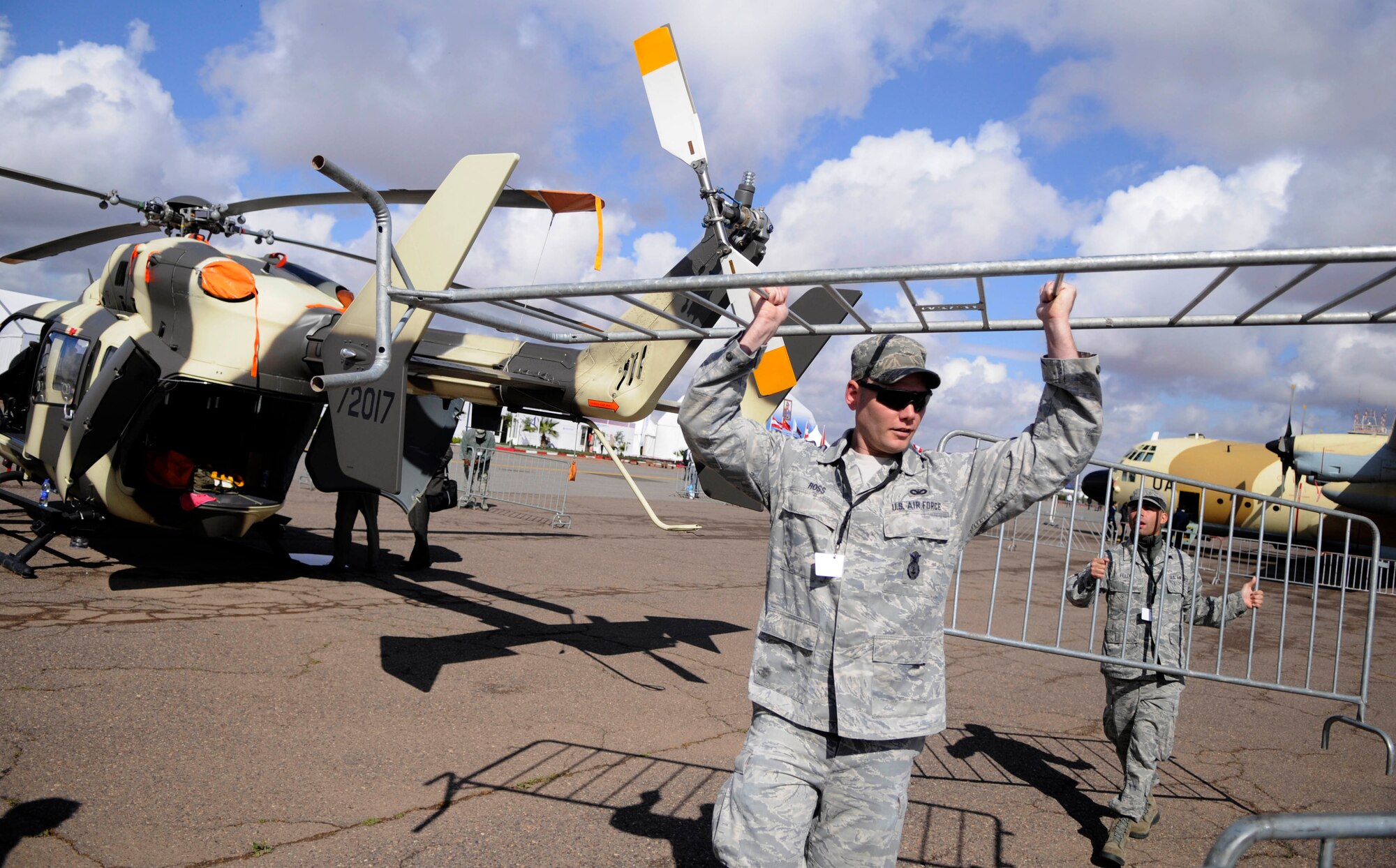 MARRAKECH, Morrocco -- Staff Sgt. Matthew Ross, left,and Staff Sgt. Anthony Felix, move security barriers around U.S. aircraft April 5, 2012 at the Aeroexpo Marrakech 2012. Ross and Felix are members of the 818th Contingency ResponseGroup and are at the Aeroexpo to provide security for U.S. aircraft at the event. They also act as liaisons for visitors with questions about the aircraft. The U.S. Air Force is participating in the third biennial Aeroexpo Marrakech to strengthen the partnerships with the nations involved and show commitment to security and stability in the region. Security forces teams members are providing security for U.S. aircraft for the entirety of the Aeroexpo. (U.S. Air Force photo/Senior Airman Natasha Stannard)