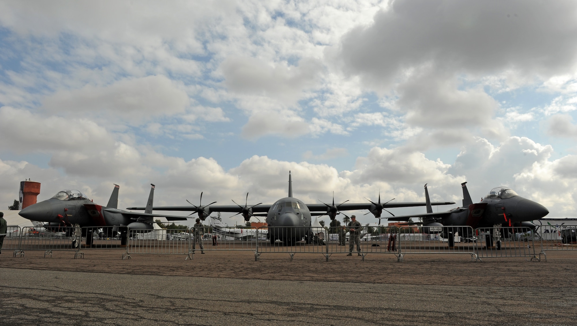MARRAKECH, Morocco -- A C-130J Super Hercules sits between two F-15E Strike Eagles on the flightline at the Marrakech Aeroexpo April 4, 2012. U.S. Air Forces Africa is participating the third biennial Aeroexpo Marrakech to strengthen the partnerships with the nations involved and show commitment to security and stability in the region. (U.S. Air Force photo/Staff Sgt. Benjamin Wilson)