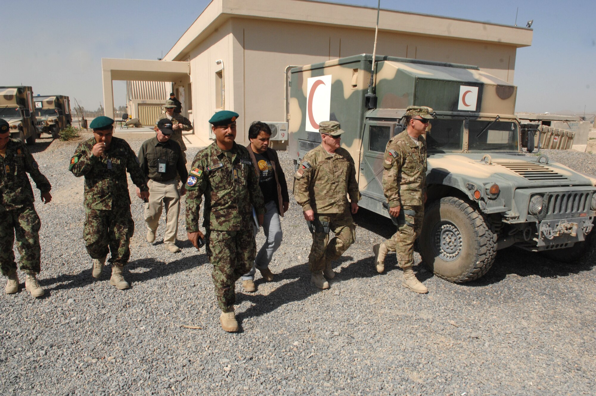 Afghan enlisted leaders take Chief Master Sgt. John Hoffman, 438th Air Expeditionary Wing command chief, on a tour of the Afghan compound at Kandahar Airfield, Afghanistan, April 5. The tour was part of the Chief?s battlefield circulation to visit geographically-separated units. (U.S. Air Force photo by Tech. Sgt. Jeremy Larlee)
