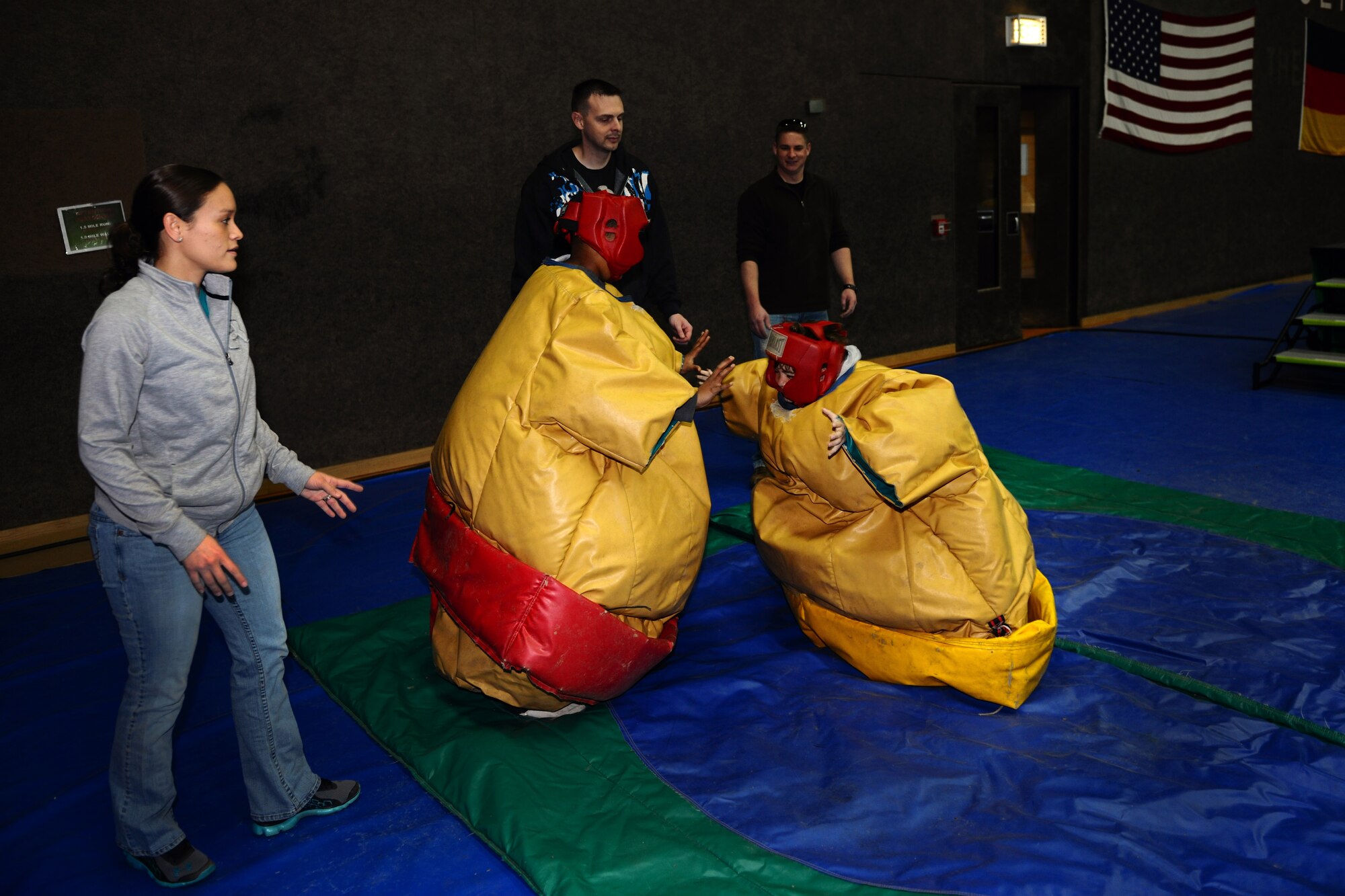 SPANGDAHLEM AIR BASE, Germany – Children sumo-wrestle each other while wearing padded suits during the Month of the Military Child Block Party at the Skelton Memorial Fitness Center here April 7. More than 25 games and activities were offered including gymnastics and hula dancing performances, as well as food, snacks and drinks for children to enjoy. The event was sponsored by the local Masonic community and 52nd Force Support Squadron to support Airmen and their families. (U.S. Air Force photo by Airman 1st Class Dillon Davis/Released)