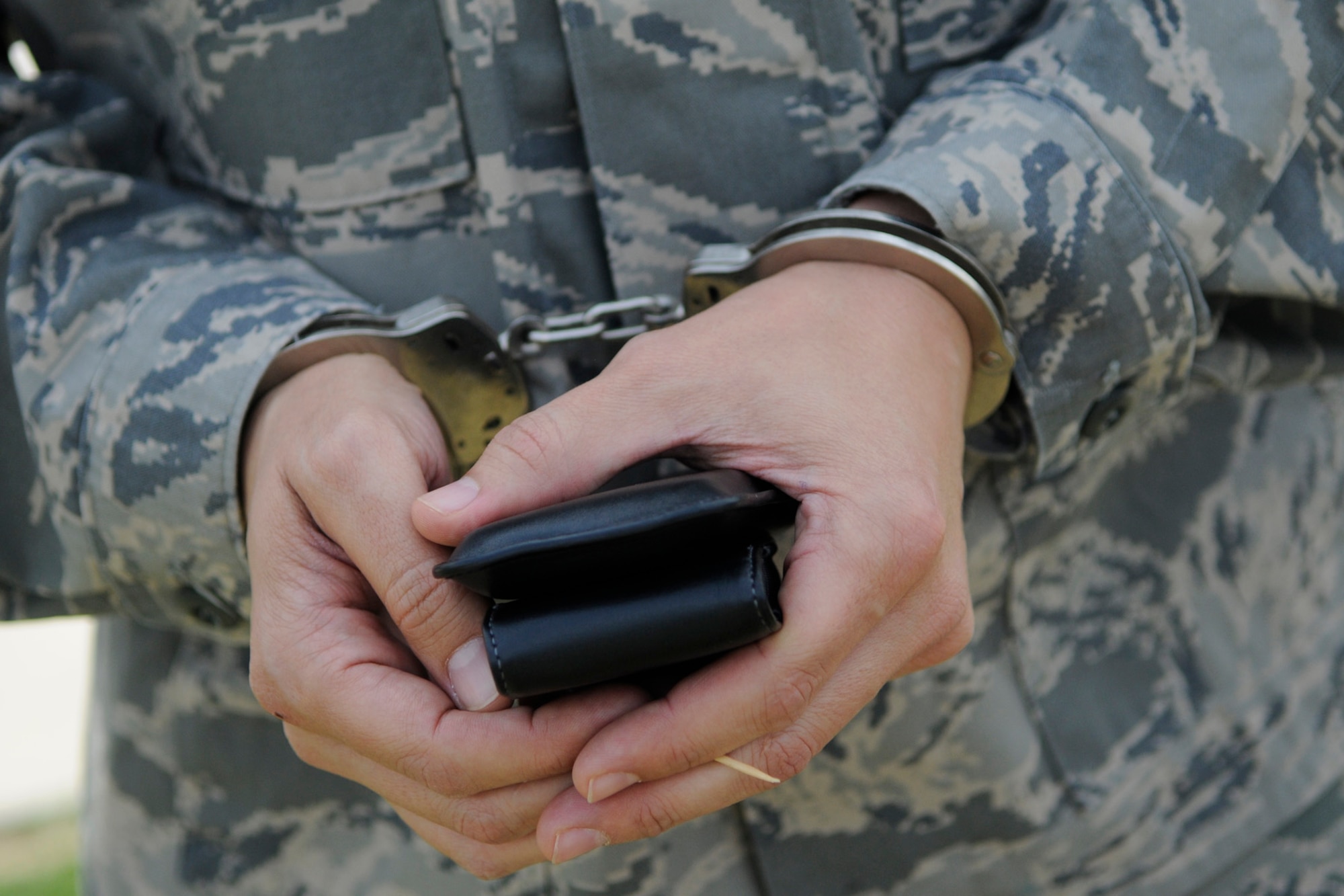 Master Sgt. Steve Zeiders, 728th Air Mobility Squadron is handcuffed for AFN Incirlik's Air Force Assistance Fund jailathon at the telethon April 5, 2012, at Incirlik Air Base, Turkey. A member of Team Incirlik paid to have Zeiders jailed and perform a jailathon challenge on live television. The telethon involved an auction of goods and services from local vendors, as well as faux arrests and bail bonds, which raised more than $6,000 for the AFAF in 12 hours. (U.S. Air Force photo by Staff Sgt. Kali L. Gradishar/Released)
