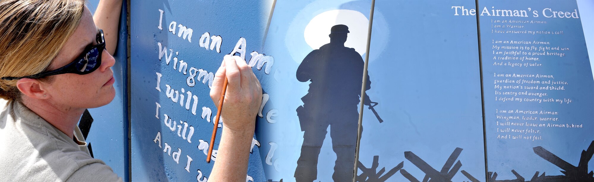 (Left) Master Sgt. Kathryn Manning, 455 Air Expeditionary Wing Superintendent of Chapel Operations, applies the finishing touches to the Airman's Creed Wall near Bagram's Camp Cunningham.  The Airman's Creed Wall project was completed on March 27, 2012. (U.S. Air Force Photo Illustration / Airman 1st Class Ericka Engblom)