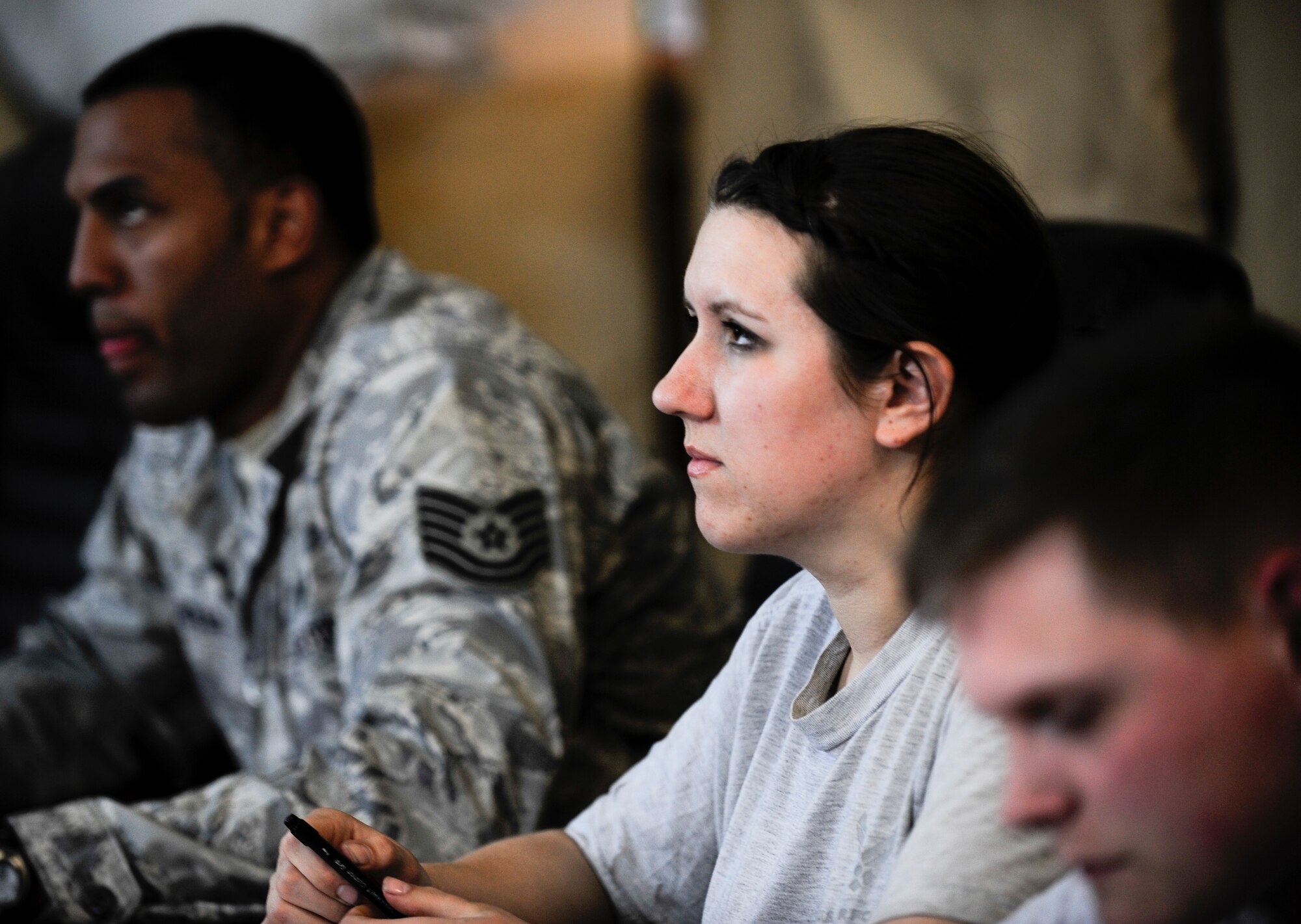 Senior Airman Jessica Mihalik focuses on a basic Russian language class lecture April 3, 2012, at the Transit Center at Manas, Kyrgyzstan. The class is hosted by the Theater Security Cooperation division twice a week for two months. Mihalik is a 376th Expeditionary Logistics Readiness Squadron vehicle maintenance technician deployed here from Ramstein Air Base, Germany. (U.S. Air Force photo/Staff Sgt. Angela Ruiz)