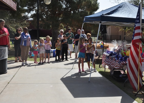 Members of the U.S. Army Corps of Engineers Los Angeles District team and their families recite the Pledge of Allegiance before the 2012 Engineer Day Celebration held in Phoenix at the McCormick-Stillman Railroad Park April 6. The Arizona-Nevada Area Office holds the celebration earlier than the official June timeframe in order to allow for more participation before the Arizona summer sets in.
