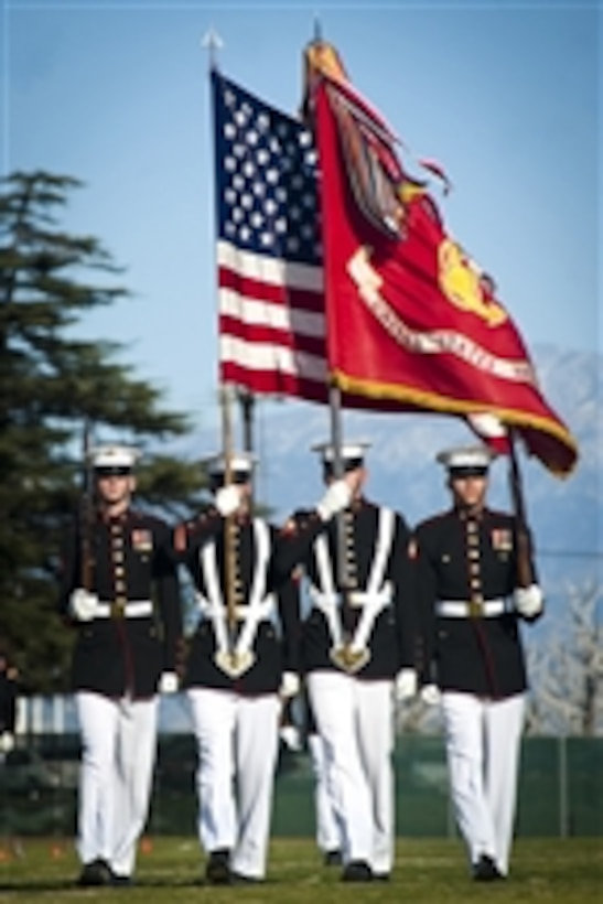 The U.S. Marine Corps Color Guard marches during pass in review during the closing of a Battle Color Detachment ceremony at Eisenhower High School, Rialto, Calif., on March 4, 2012.  The Battle Color Detachment is made up of the Marine Corps Color Guard, U.S. Marine Drum & Bugle Corps and Marine Corps Silent Drill Platoon, was on its National Installations Tour.  