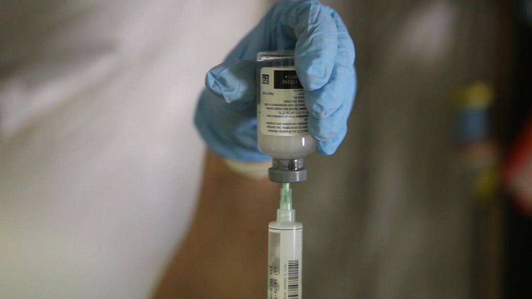 A nurse with the Shock Trauma Platoon, Surgical Company, 1st Maintenance Battalion (-) Reinforced, 1st Marine Logistics Group (Forward) fills a syringe at the STP/FRSS at Forward Operating Base Edinburgh, Afghanistan, April 10. Following an incident in nearby Musa Qa’lah in Helmand Province, the STP/FRSS received 11 critically wounded patients.