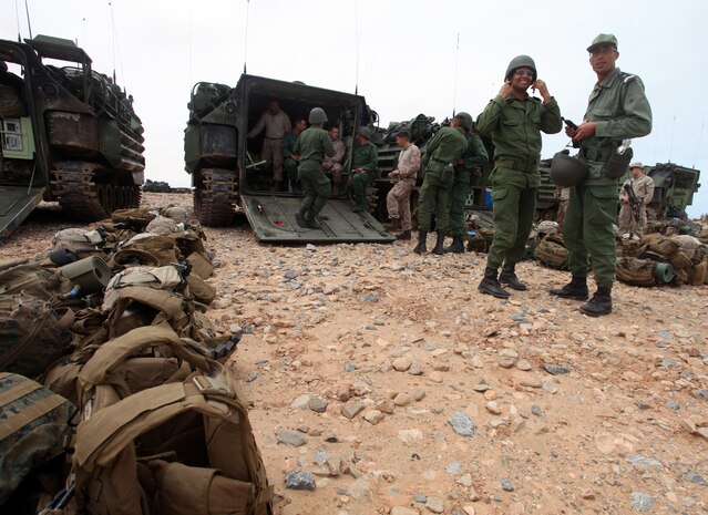 Marines and Sailors with Alpha Company, Battalion Landing Team 1st Battalion, 2nd Marine Regiment, 24th Marine Expeditionary Unit, meet and take pictures with members of the Royal Moroccan Armed Forces in an Assault Amphibious Vehicles on the shores of Morocco April 10, 2012, during exercise African Lion 12. The training allowed the Marines to introduce the Moroccan troops to the unique capabilities of the AAV, which the Marines drove onto the beach that morning from the USS New York off the coast of Morocco. This exercise is the first event for the 24th MEU and Iwo Jima Amphibious Ready Group, which deployed in March on a regularly scheduled deployment to serve as a theater reserve and crisis response force.