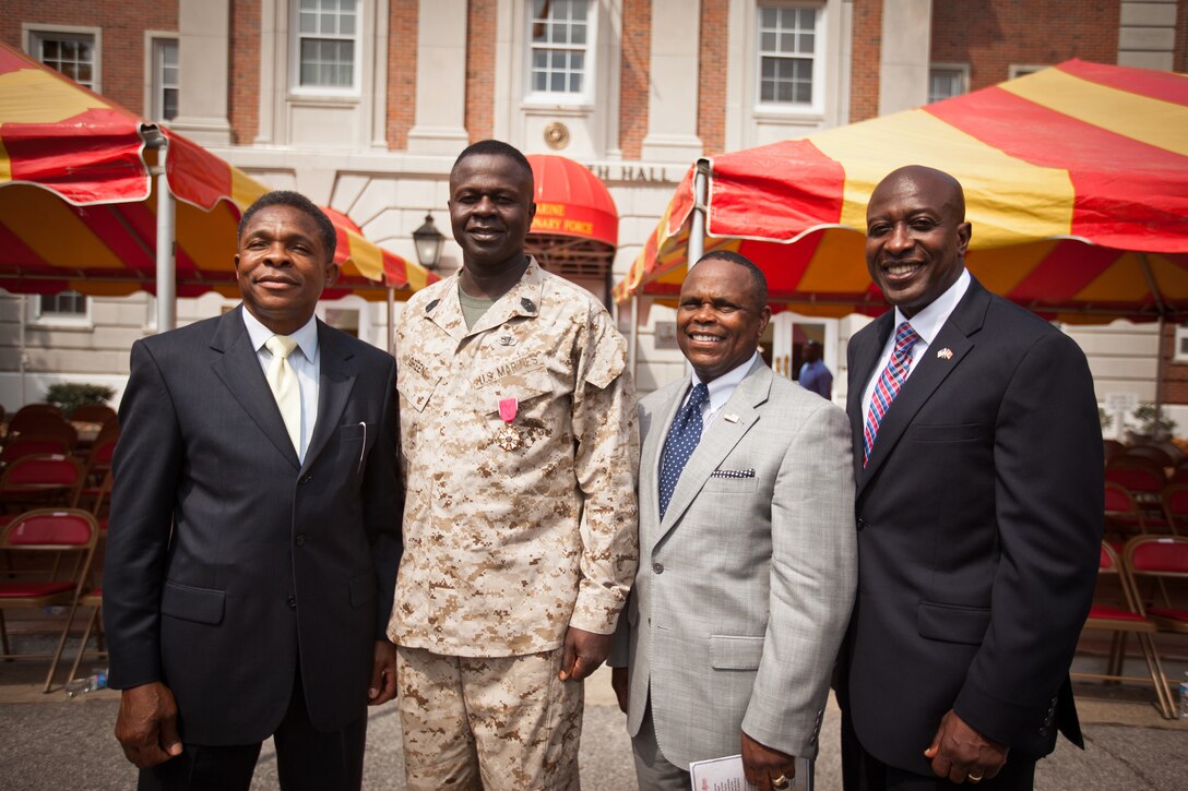 Sergeant Maj. Carl Green, outgoing sergeant major of II Marine Expeditionary Force, poses for a photo with his mentors from the drill field, retired sergeants major James E. Moore (far left) and Ron Fetherson (right) and Carlton Kent (far right), the 16th Sergeant Major of the Marine Corps, during his relief and appointment ceremony at Marine Corps Base Camp Lejeune, N.C., Mar. 30. Green recently retired after 34 years of service in the Marine Corps. 