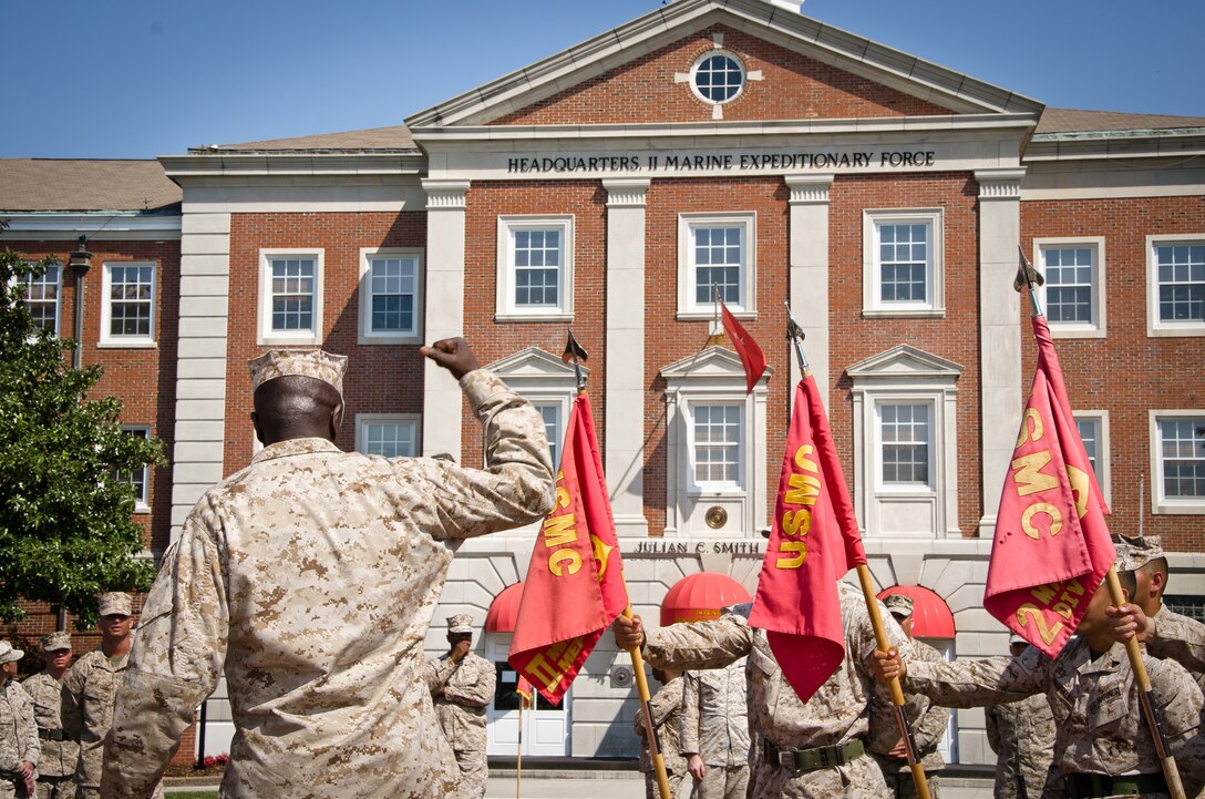 Sergeant Maj. Carl Green, outgoing sergeant major of II Marine Expeditionary Force, does a fist pump as Marines around him shout, "oo-rah!" during the rehearsal of his relief and appointment ceremony at Marine Corps Base Camp Lejeune, N.C., Mar. 29. Green recently retired after 34 years of service in the Marine Corps. 