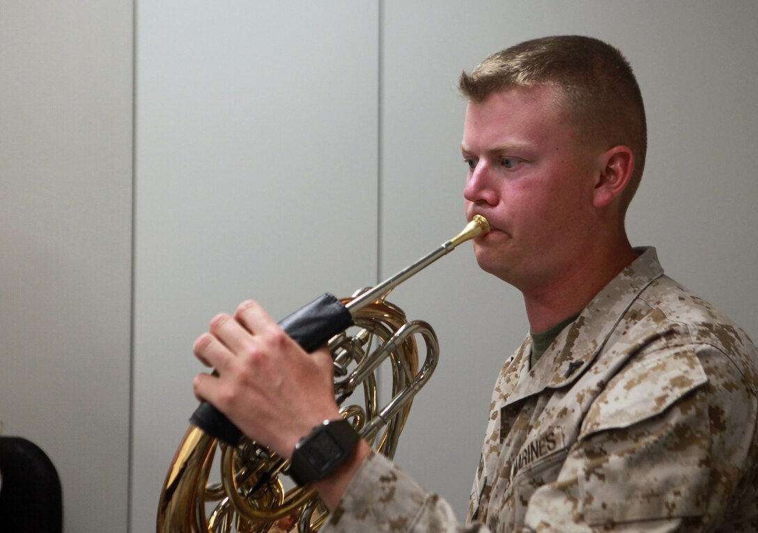 Selma, N.C., native Lance Cpl. Cameron Murray, a French Horn player with the 2nd Marine Division Band, plays his instrument during a lesson April 11 with members of the United States Marine Band, commonly referred to as The President’s Own.  The President’s Own members gave group and individual lessons to the 2nd Marine Division Band Marines throughout the week before both groups played together during a concert April 13.::r::::n::	Murray was excited to receive instruction from and play with members of The President’s Own.::r::::n::                “It’s going to be a great experience,” said Murray.  “It’s great music that we’re playing, and the audience is going to love it – it’s going to be a great concert.”