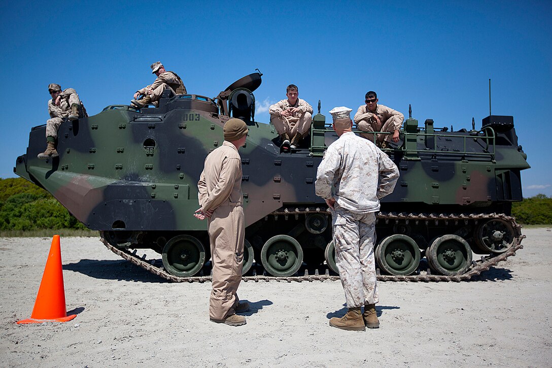 Col. Matthew St. Clair, right, 26th Marine Expeditionary Unit commanding officer, speaks to Marines with 2nd Amphibious Assault Battalion at Onslow Beach, N.C., April 11, 2012. The 26th MEU is currently providing support to the Commemoration of the Battle of New Orleans. Starting this April and continuing through 2015, the U.S. Navy, U.S. Marine Corps and U.S. Coast Guard will commemorate the Bicentennial of the War of 1812 and the Star Spangled Banner. The War of 1812 celebration will Commemorate the rich Naval history and showcase the capabilities of today's Navy-Marine Corps team. (U.S. Marine Corps photo by Cpl. Christopher Q. Stone/Released)