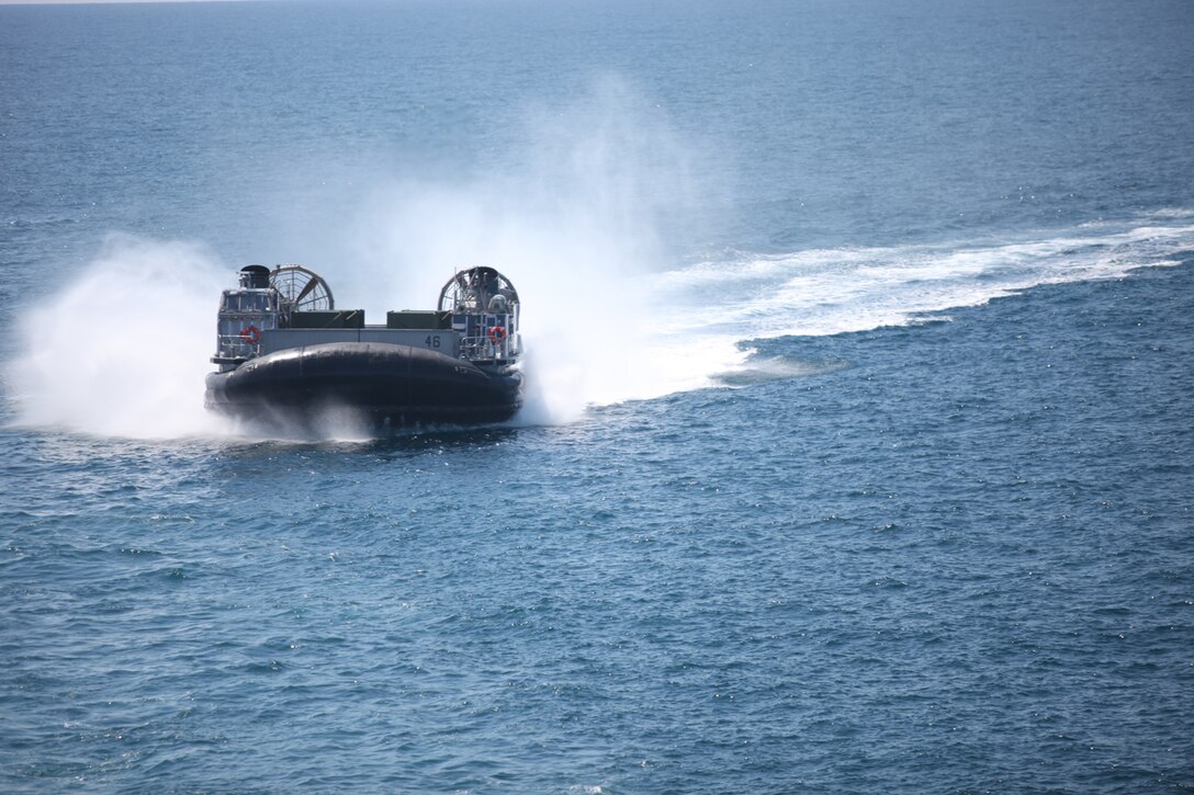 A Landing Craft Air Cushion navigates to USS Wasp (LHD-1) from Onslow Beach, N.C., April 11, 2012. The 26th Marine Expeditionary Unit is under way to support the commemoration of the Battle of New Orleans. Starting this April and continuing through 2015, the US Navy, US Marine Corps and US Coast Guard will commemorate the War of 1812 and the Star Spangled Banner. The War of 1812 celebration will commemorate the rich naval history and showcase the capabilities of today's Navy-Marine Corps Team. (U.S. Marine Corps photo by Cpl. Brannigan T. Coleman/Released)