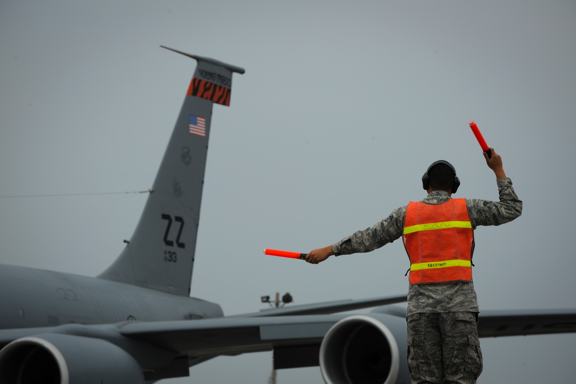 U.S. Air Force Airman 1st Class Hernani Medina, 718th Aircraft Maintance Squadron, environmental and electrician specialist, taxies out an U.S. Air Force KC-135 Stratotanker refueling aircraft on Kadena Air Base, April 5, 2012. Medina is native born from Guam. (U.S. Air Force photo by Airman 1st Class Brooke P. Beers/Released)