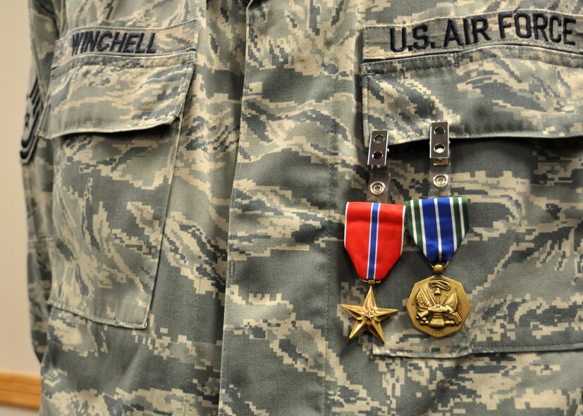 Master Sgt. Scott Winchell, 62nd Aerial Port Squadron, was awarded a Bronze Star Medal during a ceremony at April 11, 2012. In addition to accomplishing logistical tasks, Winchell exhibited the highest display of honor as he hand-carried five fallen warriors from the air ambulances in preparation for their final return home to families and loved ones. (U.S. Air Force photo/Senior Airman Leah Young)