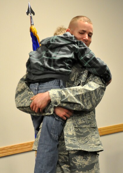 Master Sgt. Scott Winchell, 62nd Aerial Port Squadron, hugs his son following a Bronze Star ceremony April 11, 2012, at Joint Base Lewis-McChord, Wash. (U.S. Air Force photo/Senior Airman Leah Young)