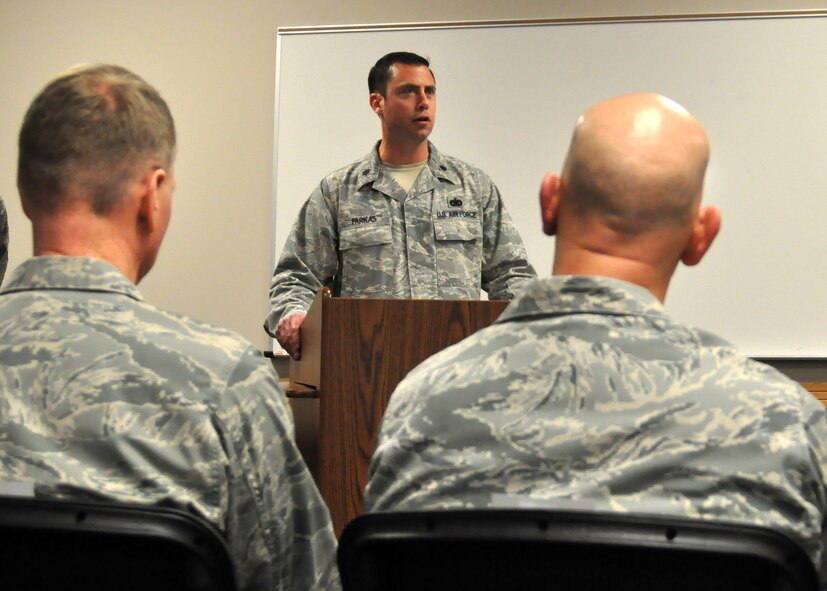Lt. Col. Robert Farkas, 62nd Aerial Port Squadron commander, delivers a speech during a Bronze Star ceremony honoring Master Sgt. Scott Winchell April 11, 2012, at Joint Base Lewis-McChord, Wash. (U.S. Air Force photo/Senior Airman Leah Young)