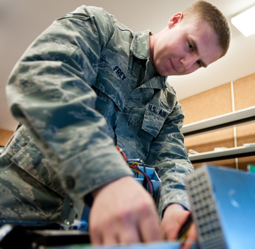 Airman 1st Class Corey Frey, 28th Communications Squadron client systems technician, unplugs wires inside a computer tower while troubleshooting a central processing unit at Ellsworth Air Force Base, S.D., April 4, 2012. Client systems technicians keep the network and systems operating by quick response and resolution of computer problems on base. (U.S. Air Force photo by Airman 1st Class Kate Thornton/Released)