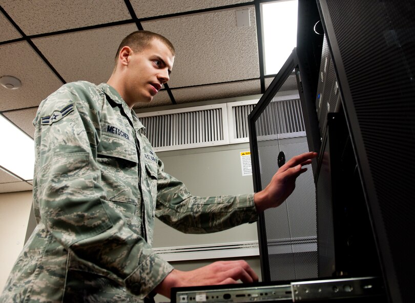 Airman 1st Class Brock Metscher, 28th Communications Squadron cyber systems operations operator, searches through a server configuration for storage space at Ellsworth Air Force Base, S.D., April 4, 2012. Electronic file keeping is becoming more prominent and it is crucial that there is adequate space on servers for agencies to store and manage their electronic files. (U.S. Air Force photo by Airman 1st Class Kate Thornton/Released)